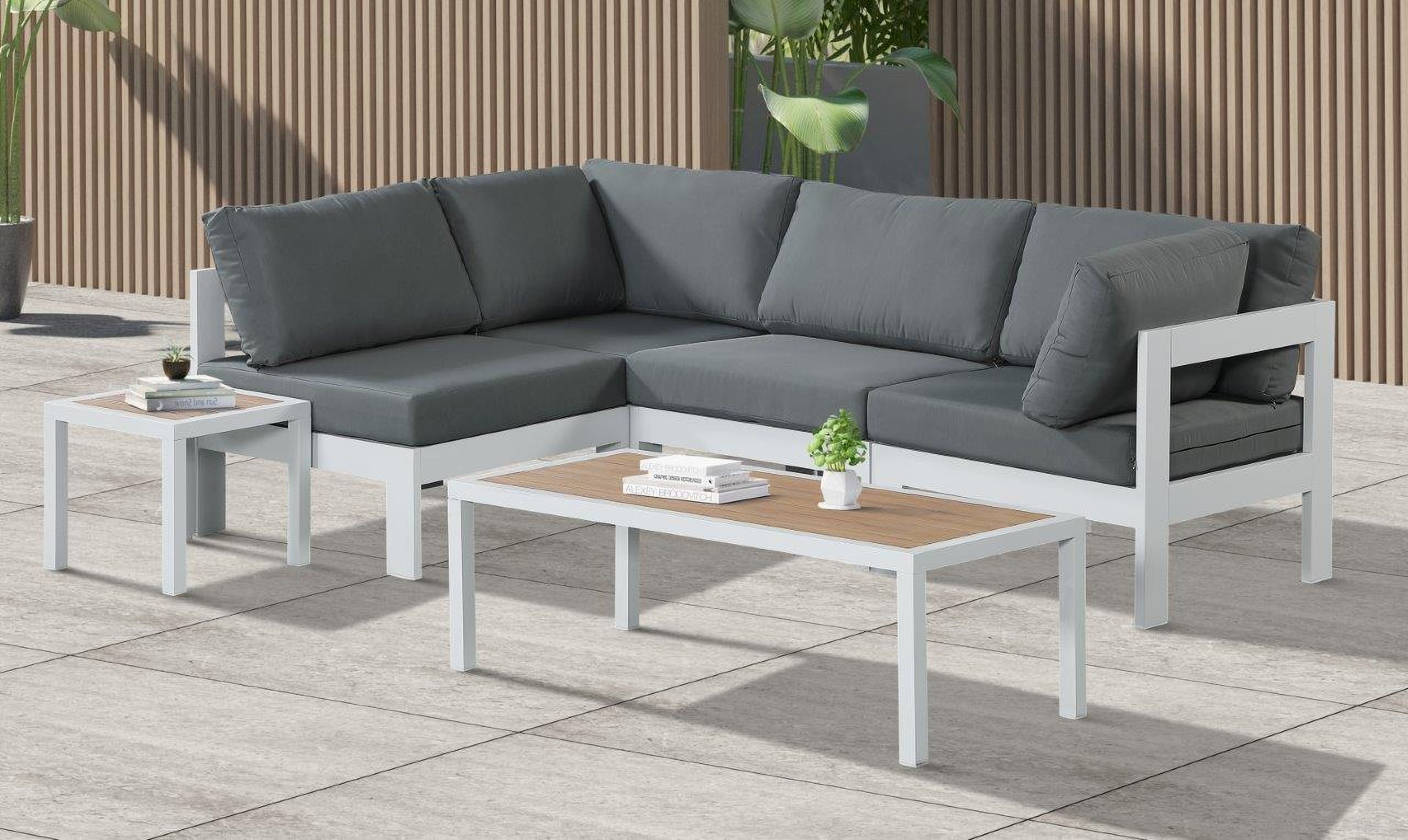 The appearance of Nizuc Water Resistant Fabric Outdoor Patio 4 Piece Modular Sectional In Grey designed by Meridian in the modern / contemporary interior design. This grey piece of furniture  was selected by 1StopBedrooms from Nizuc Collection to add a touch of cosiness and style into your home. Sku: 375Grey-Corner;375Grey-Corner;375Grey-Armless;375Grey-Armless. Material: Aluminum.