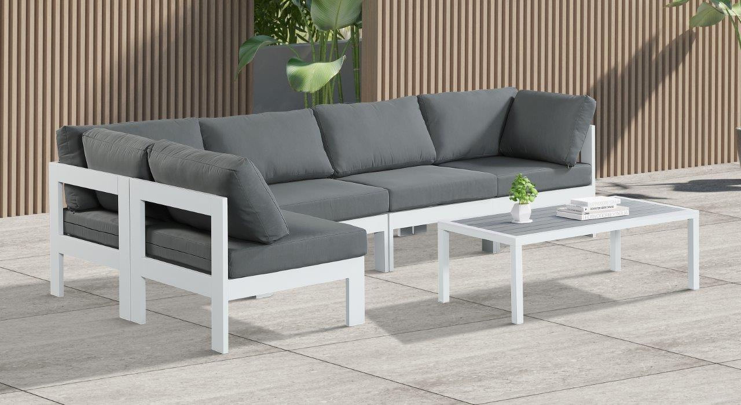 The appearance of Nizuc Water Resistant Fabric Outdoor Patio 5 Piece Modular Sectional In Grey designed by Meridian in the modern / contemporary interior design. This grey piece of furniture was selected by 1StopBedrooms from Nizuc Collection to add a touch of cosiness and style into your home. Sku: 375Grey-Corner;375Grey-Corner;375Grey-Armless;375Grey-Armless;375Grey-Armless. Material: Aluminum.