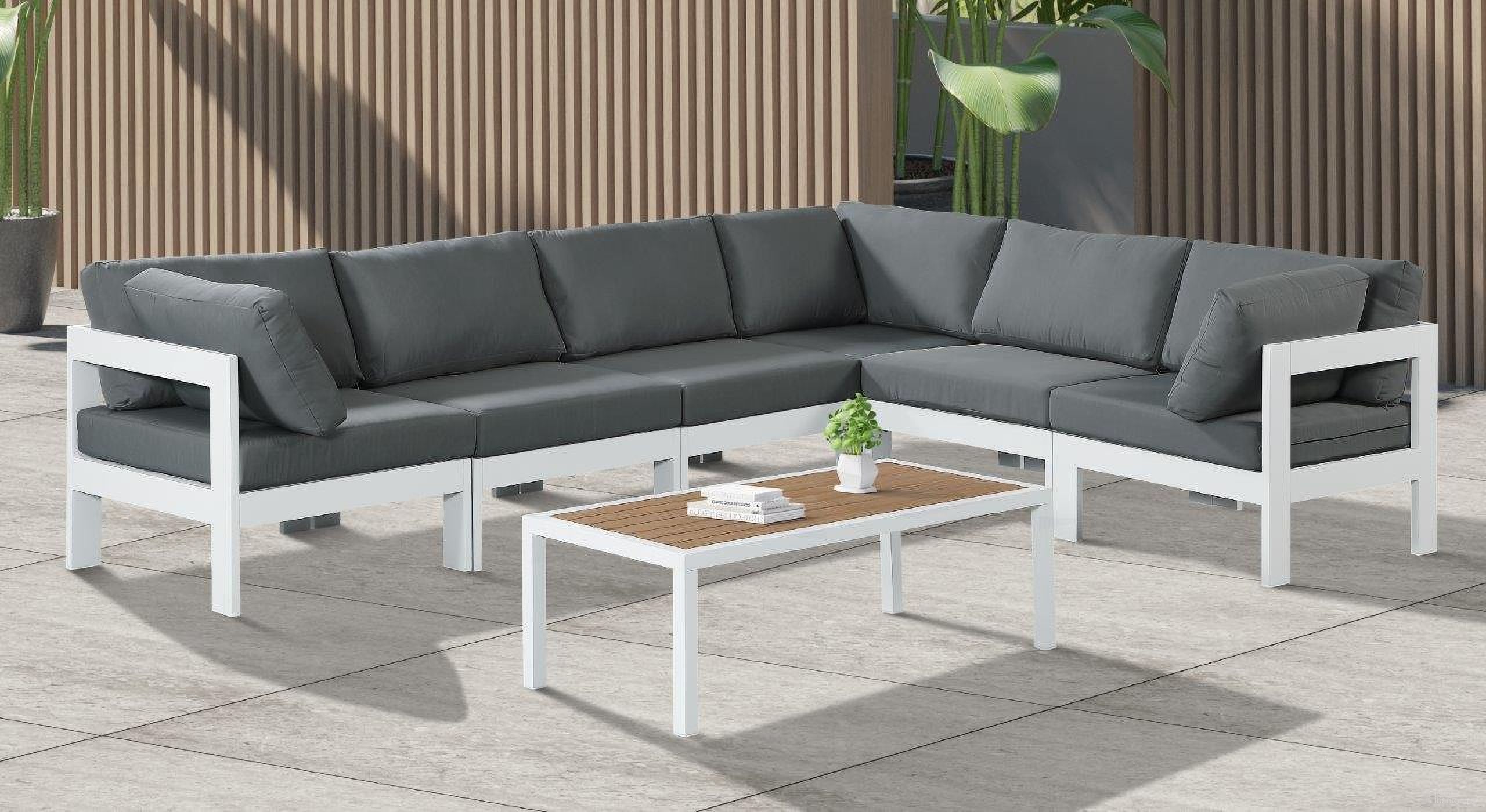 The appearance of Nizuc Water Resistant Fabric Outdoor Patio 6 Piece Modular Sectional In Grey designed by Meridian in the modern / contemporary interior design. This grey piece of furniture was selected by 1StopBedrooms from Nizuc Collection to add a touch of cosiness and style into your home. Sku: 375Grey-Corner;375Grey-Corner;375Grey-Corner;375Grey-Armless;375Grey-Armless;375Grey-Armless. Material: Aluminum.