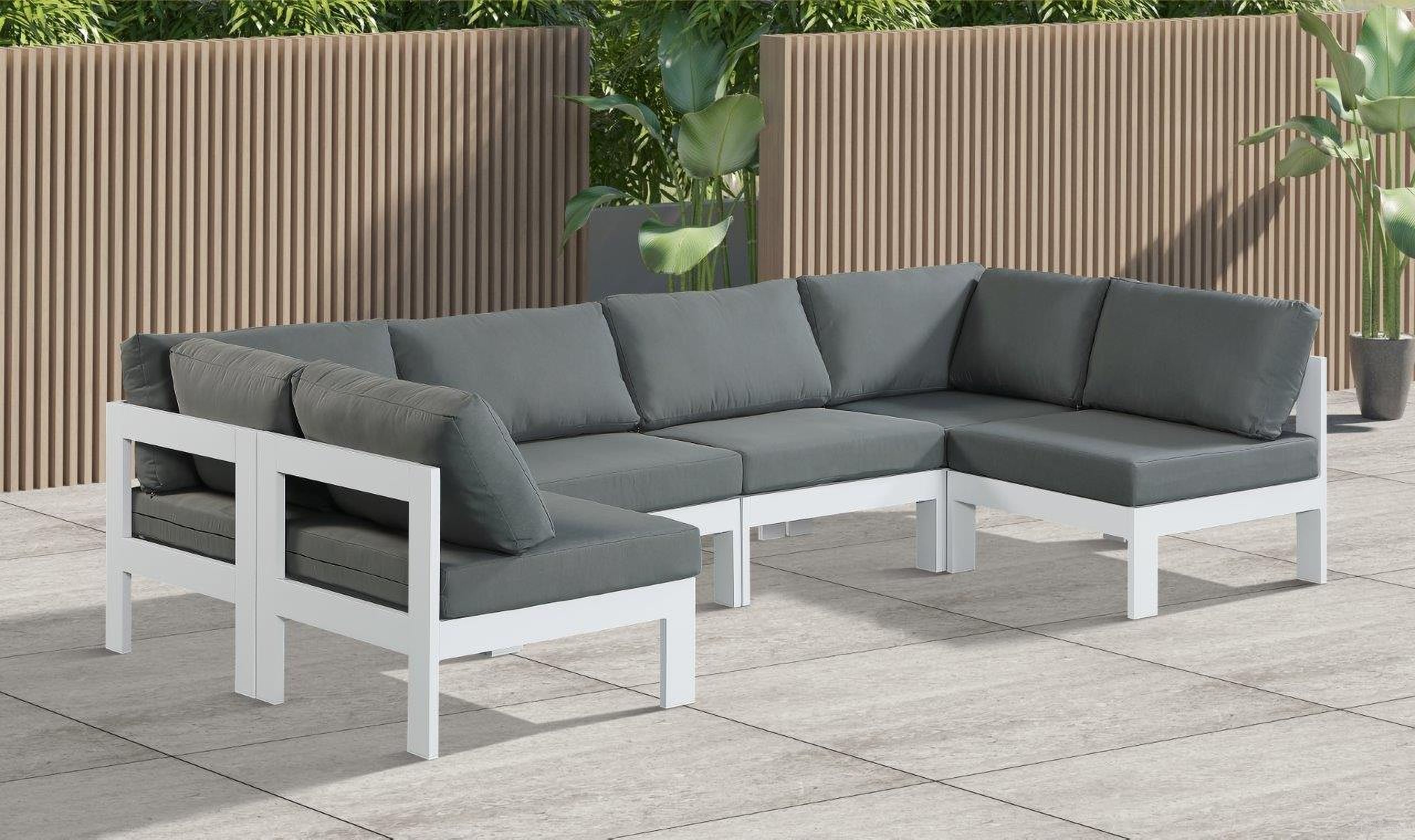 The appearance of Nizuc Water Resistant Fabric Outdoor Patio 6 Piece Modular Sectional In Grey designed by Meridian in the modern / contemporary interior design. This grey piece of furniture was selected by 1StopBedrooms from Nizuc Collection to add a touch of cosiness and style into your home. Sku: 375Grey-Corner;375Grey-Corner;375Grey-Armless;375Grey-Armless;375Grey-Armless;375Grey-Armless. Material: Aluminum.