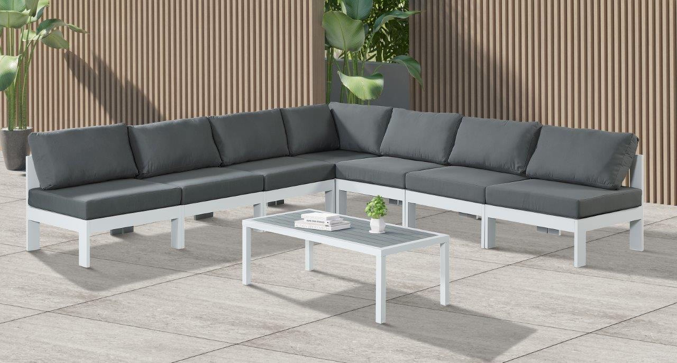 The appearance of Nizuc Water Resistant Fabric Outdoor Patio 7 Piece Modular Sectional In Grey designed by Meridian in the modern / contemporary interior design. This grey piece of furniture  was selected by 1StopBedrooms from Nizuc Collection to add a touch of cosiness and style into your home. Sku: 375Grey-Corner;375Grey-Armless;375Grey-Armless;375Grey-Armless;375Grey-Armless;375Grey-Armless;375Grey-Armless. Material: Aluminum.