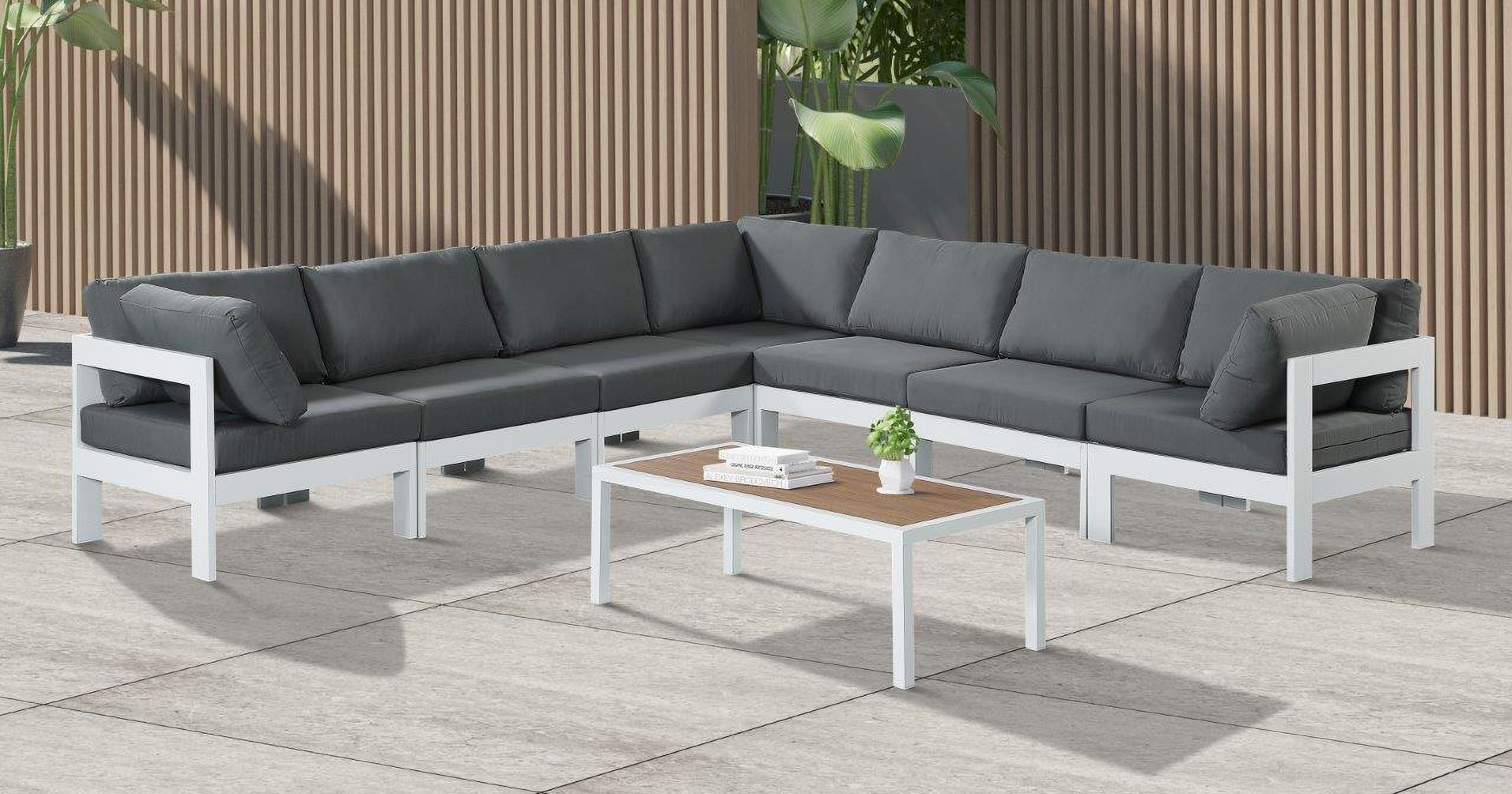 The appearance of Nizuc Water Resistant Fabric Outdoor Patio 7 Piece Modular Sectional In Grey designed by Meridian in the modern / contemporary interior design. This grey piece of furniture  was selected by 1StopBedrooms from Nizuc Collection to add a touch of cosiness and style into your home. Sku: 375Grey-Corner;375Grey-Corner;375Grey-Corner;375Grey-Armless;375Grey-Armless;375Grey-Armless;375Grey-Armless. Material: Aluminum.
