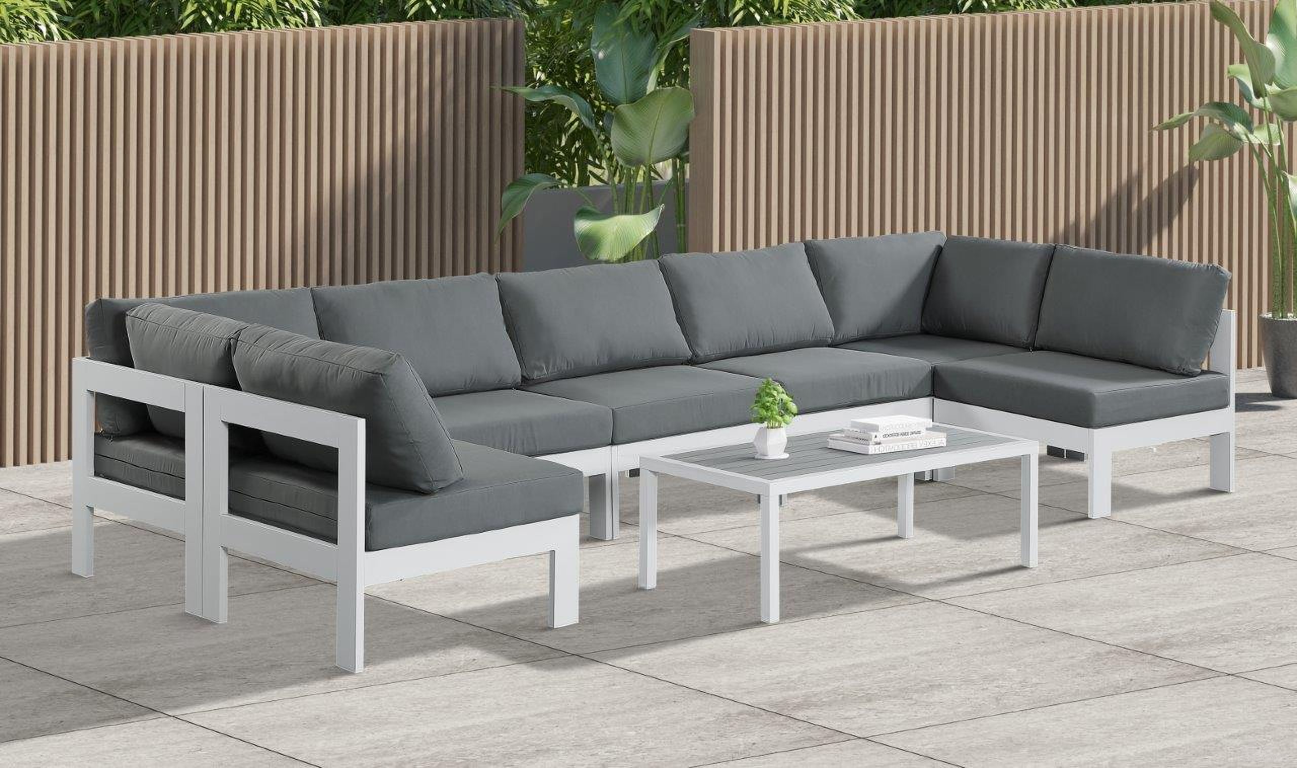 The appearance of Nizuc Water Resistant Fabric Outdoor Patio 7 Piece Modular Sectional In Grey designed by Meridian in the modern / contemporary interior design. This grey piece of furniture  was selected by 1StopBedrooms from Nizuc Collection to add a touch of cosiness and style into your home. Sku: 375Grey-Corner;375Grey-Corner;375Grey-Armless;375Grey-Armless;375Grey-Armless;375Grey-Armless;375Grey-Armless. Material: Aluminum.
