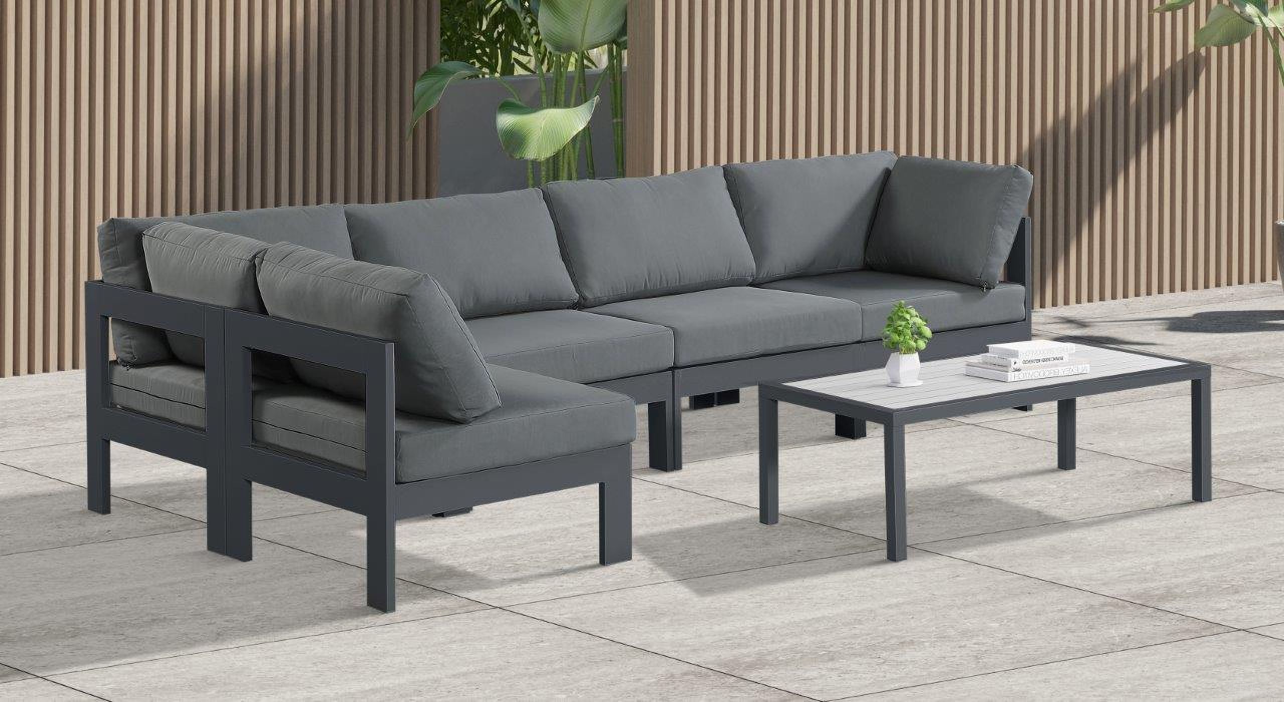 The appearance of Nizuc Water Resistant Fabric Outdoor Patio 5 Piece Modular Sectional In Grey designed by Meridian in the modern / contemporary interior design. This grey piece of furniture was selected by 1StopBedrooms from Nizuc Collection to add a touch of cosiness and style into your home. Sku: 376Grey-Corner;376Grey-Corner;376Grey-Armless;376Grey-Armless;376Grey-Armless. Material: Aluminum.