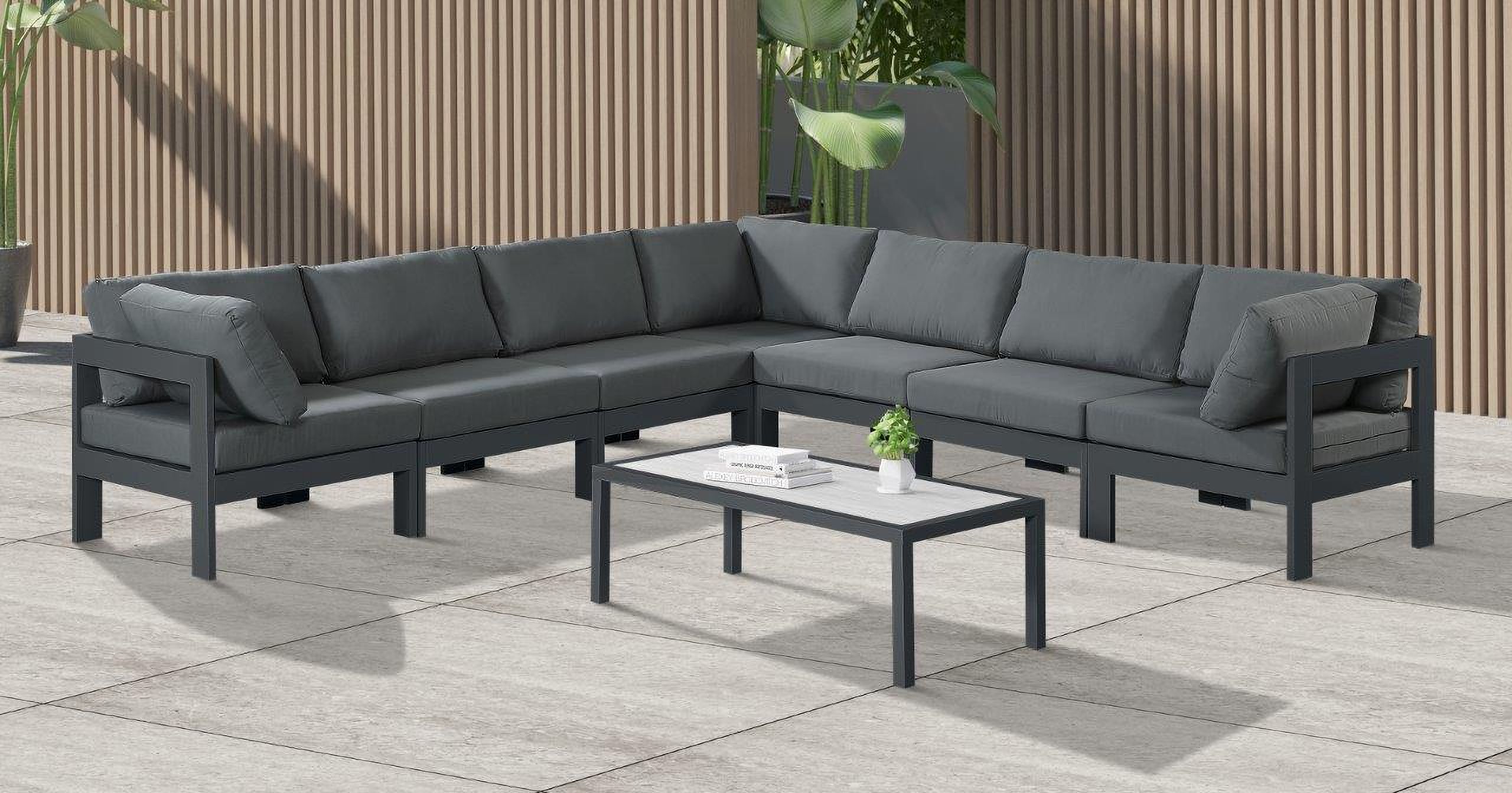 The appearance of Nizuc Water Resistant Fabric Outdoor Patio 7 Piece Modular Sectional In Grey designed by Meridian in the modern / contemporary interior design. This grey piece of furniture  was selected by 1StopBedrooms from Nizuc Collection to add a touch of cosiness and style into your home. Sku: 376Grey-Corner;376Grey-Corner;376Grey-Corner;376Grey-Armless;376Grey-Armless;376Grey-Armless;376Grey-Armless. Material: Aluminum.