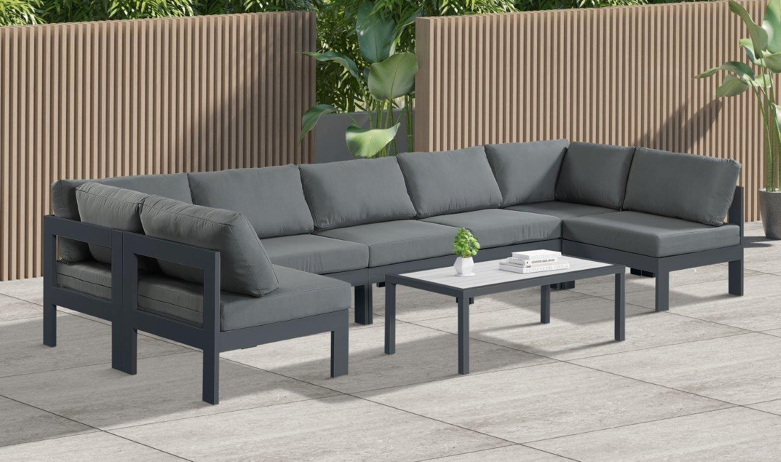 The appearance of Nizuc Water Resistant Fabric Outdoor Patio 7 Piece Modular Sectional In Grey designed by Meridian in the modern / contemporary interior design. This grey piece of furniture  was selected by 1StopBedrooms from Nizuc Collection to add a touch of cosiness and style into your home. Sku: 376Grey-Corner;376Grey-Corner;376Grey-Armless;376Grey-Armless;376Grey-Armless;376Grey-Armless;376Grey-Armless. Material: Aluminum.