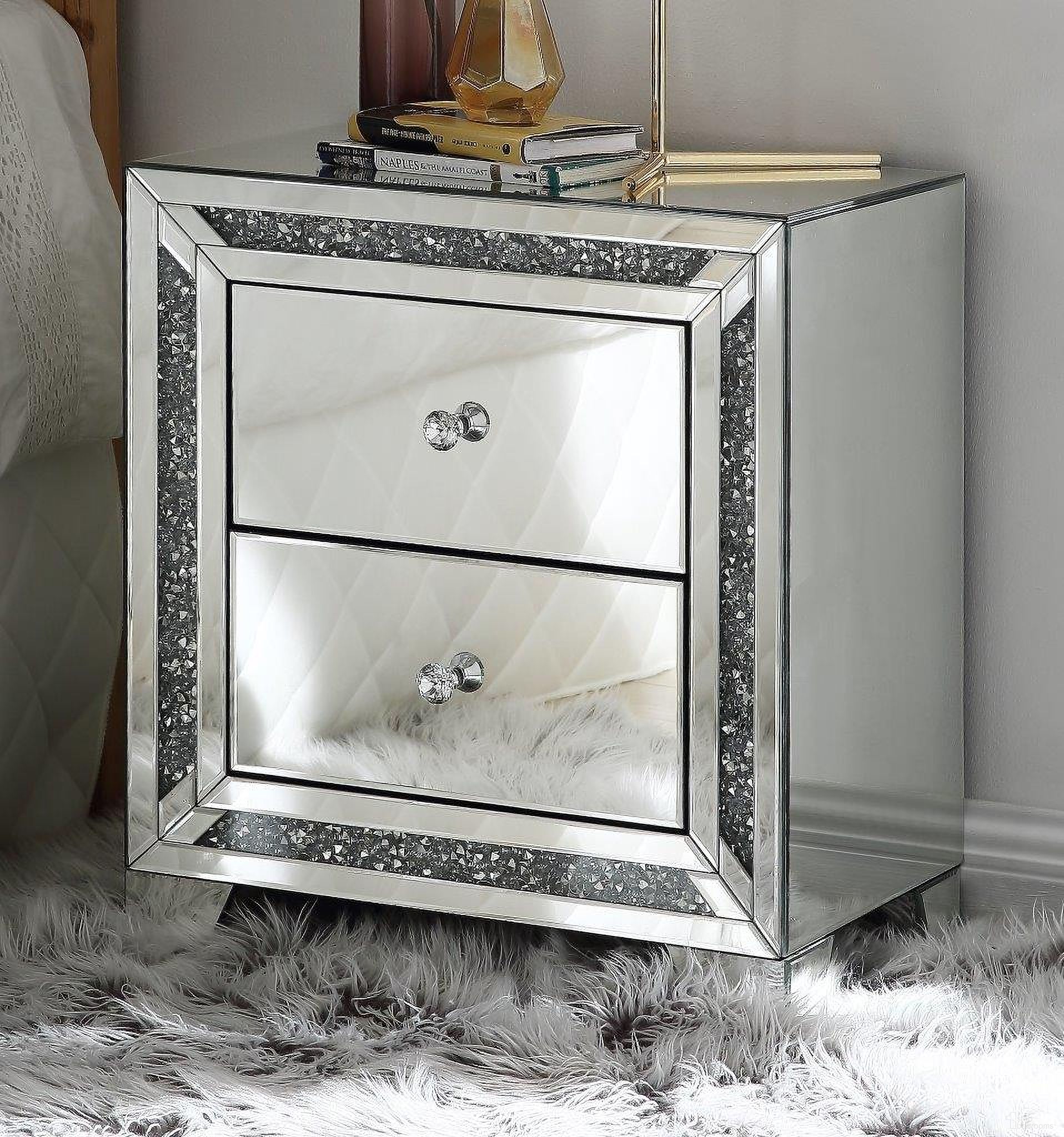 The appearance of Noralie 22 Inch Mirrored and Faux Diamonds Night Table designed by ACME in the glam interior design. This mirrored piece of furniture  was selected by 1StopBedrooms from Noralie Collection to add a touch of cosiness and style into your home. Sku: 97647. Material: Wood.