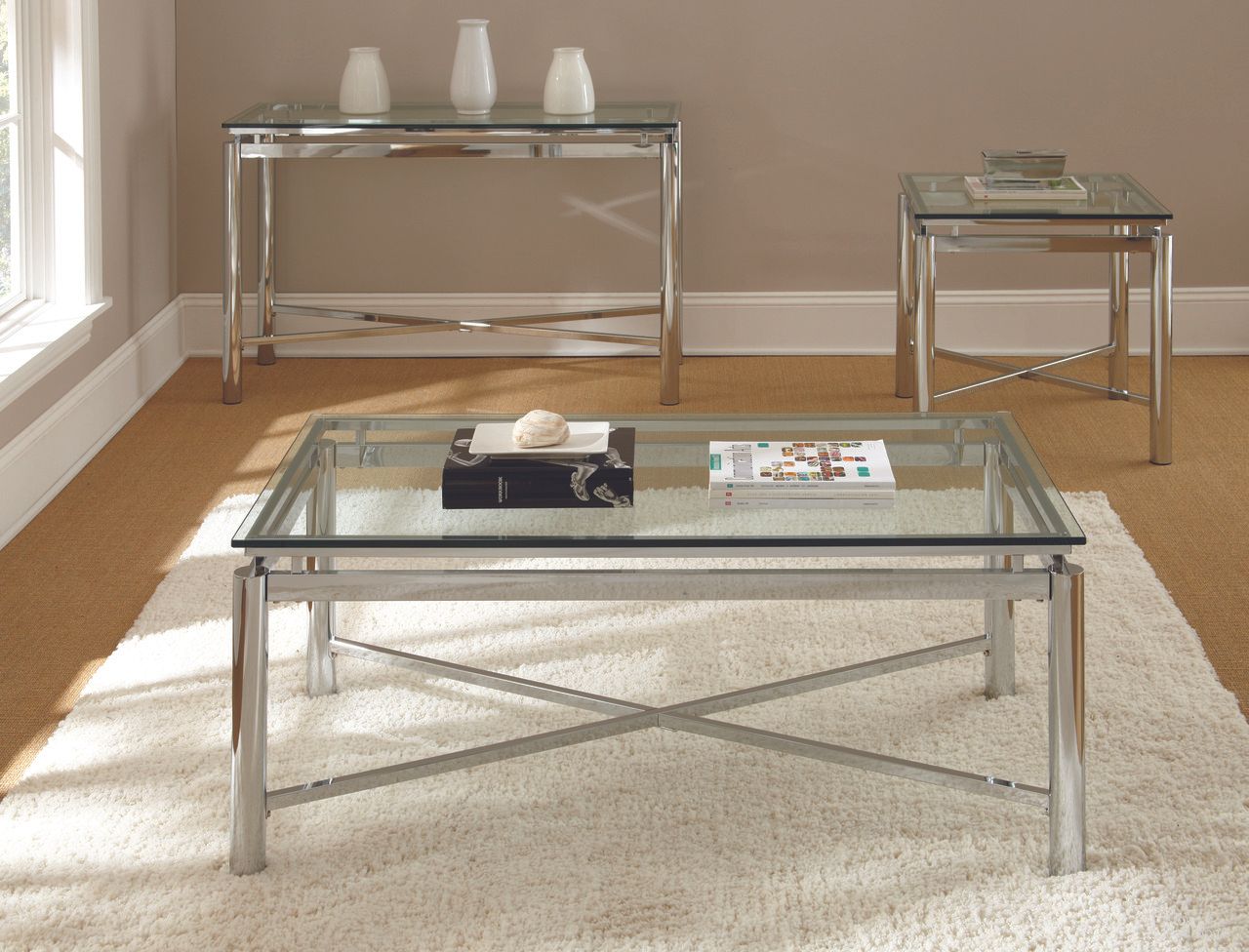 The appearance of Nova Glass Top Rectangular Occasional Table Set designed by Steve Silver in the modern / contemporary interior design. This silver piece of furniture  was selected by 1StopBedrooms from Nova Collection to add a touch of cosiness and style into your home. Sku: NV100CB;NV100CT;NV100EB;NV100ET. Material: Glass.