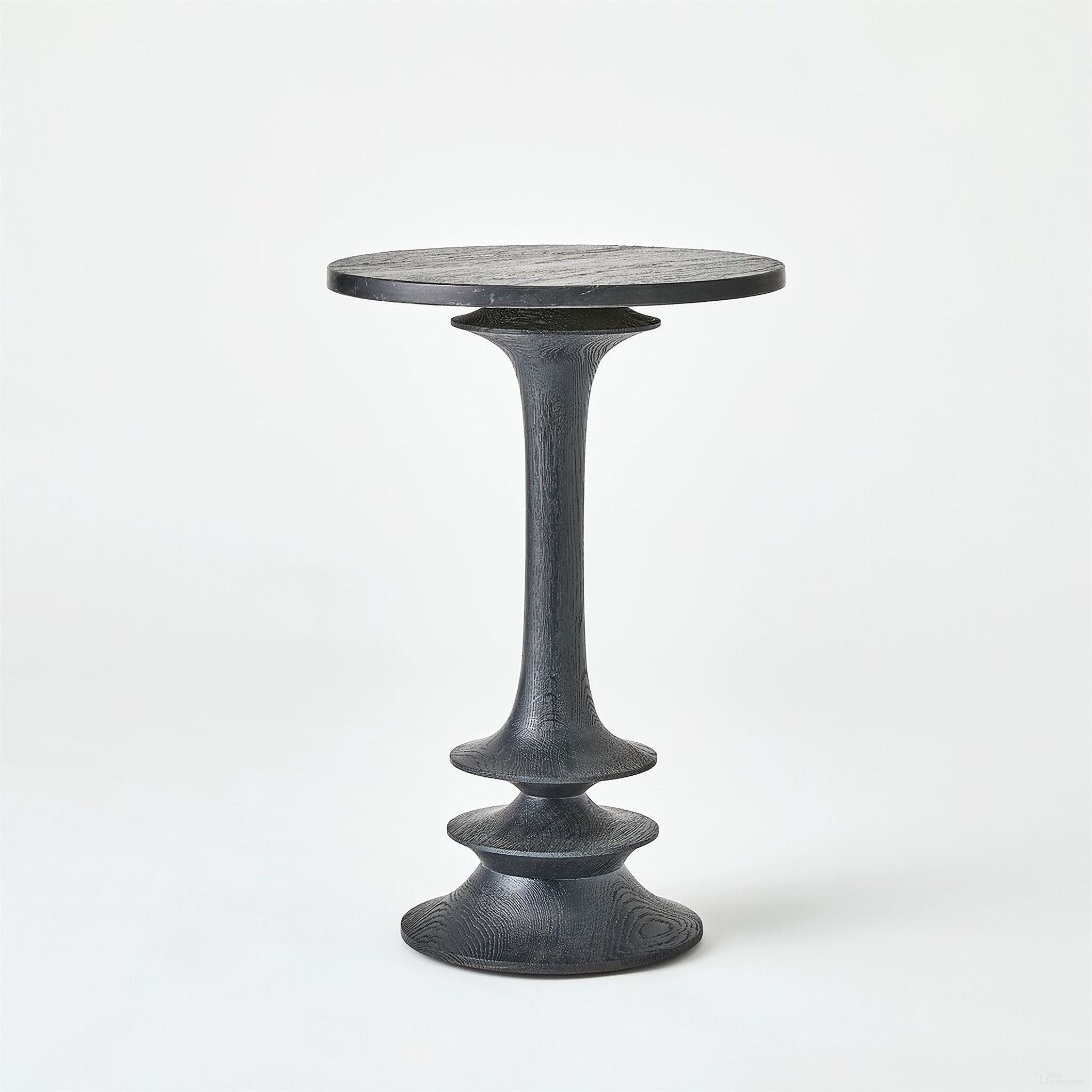 The appearance of Oasis Medium Side Table In Black designed by Global Views in the modern / contemporary interior design. This black piece of furniture  was selected by 1StopBedrooms from Oasis Collection to add a touch of cosiness and style into your home. Sku: 993936. Material: Wood.