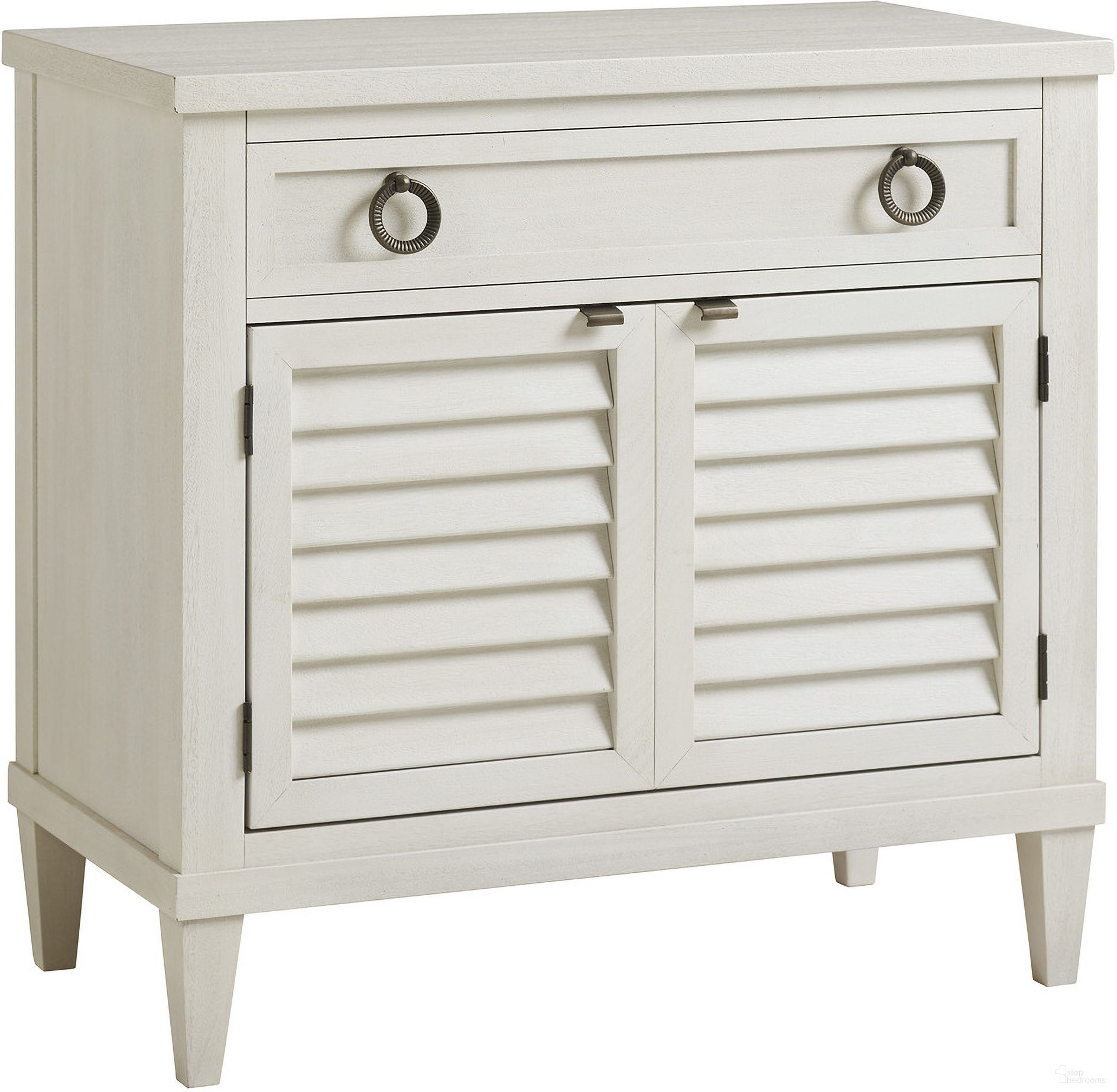 The appearance of Ocean Breeze Glades Nightstand In Sand designed by Tommy Bahama in the transitional interior design. This sand piece of furniture was selected by 1StopBedrooms from Ocean Breeze Collection to add a touch of cosiness and style into your home. Sku: 570-623. Material: Wood.