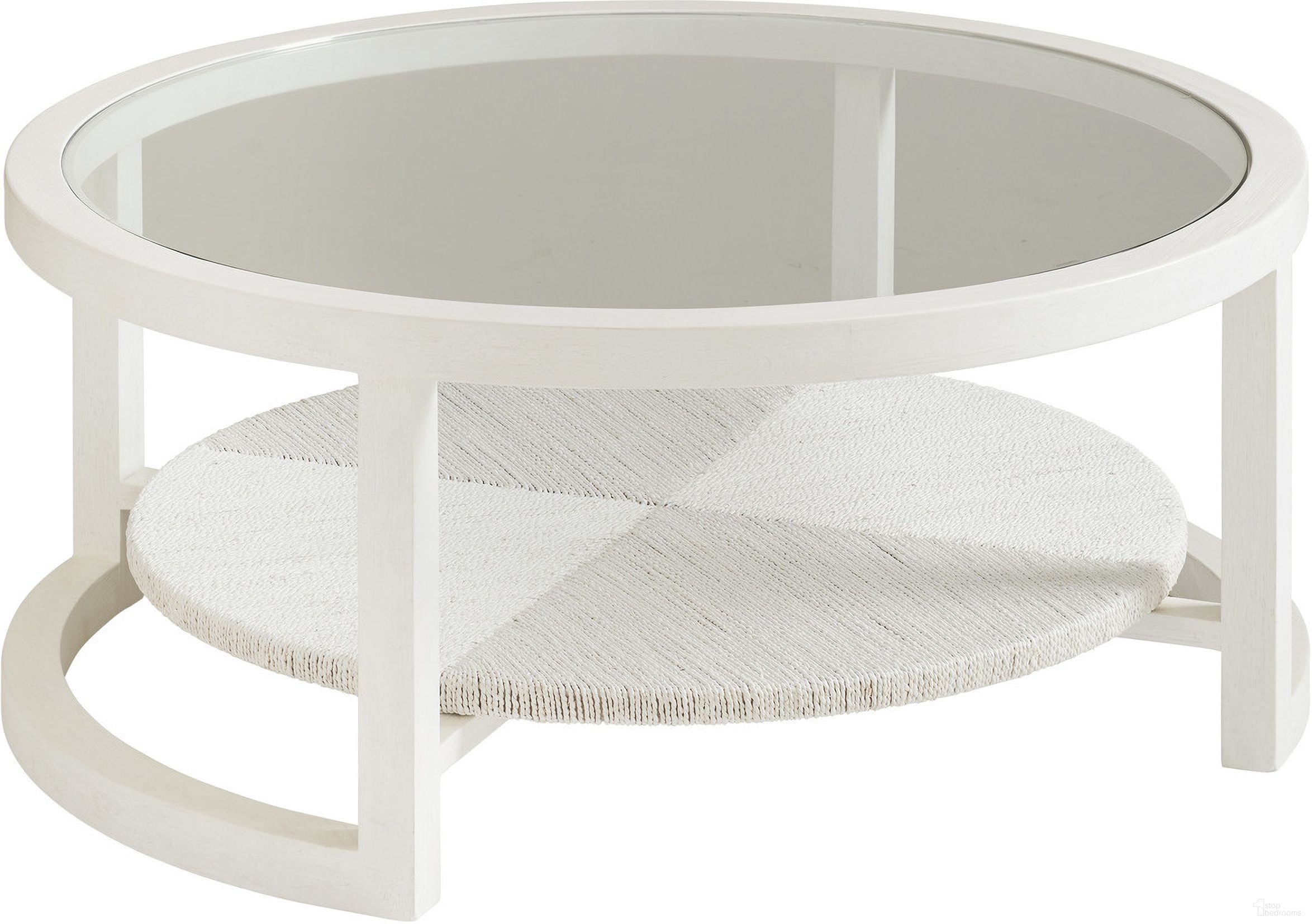 The appearance of Ocean Breeze Pompano Round Cocktail Table In Sand designed by Tommy Bahama in the transitional interior design. This sand piece of furniture  was selected by 1StopBedrooms from Ocean Breeze Collection to add a touch of cosiness and style into your home. Sku: 570-947. Material: Wood.