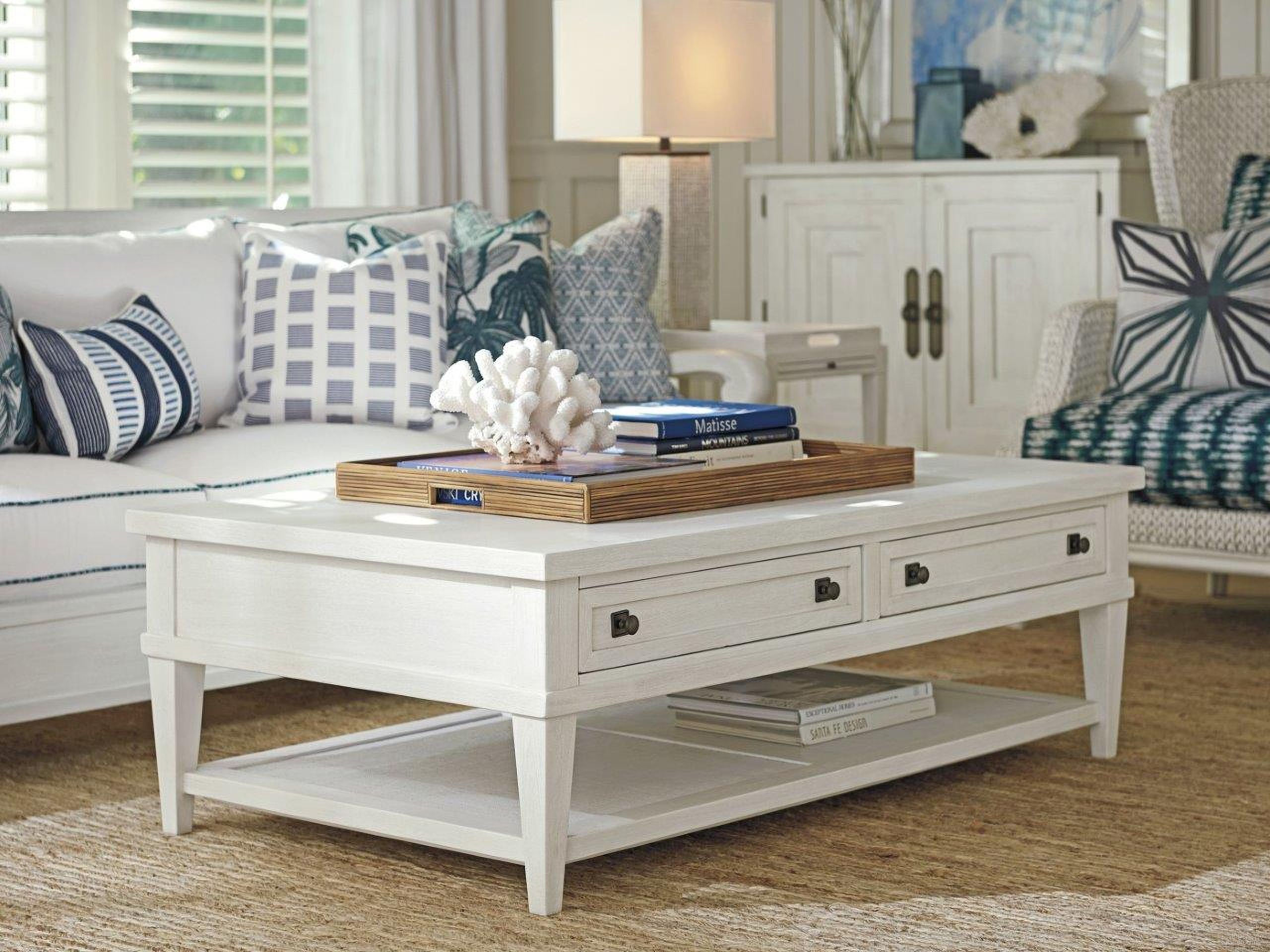 The appearance of Ocean Breeze Sand Palm Coast Rectangular Occasional Table Set designed by Tommy Bahama in the transitional interior design. This sand piece of furniture  was selected by 1StopBedrooms from Ocean Breeze Collection to add a touch of cosiness and style into your home. Sku: 570-949;570-952. Material: Wood.