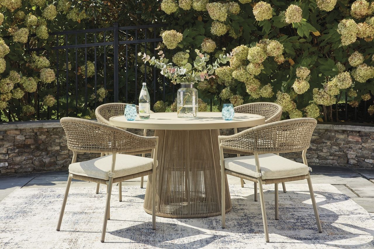 The appearance of Ocean Park Outdoor Dining Room Set In Beige designed by Signature Design by Ashley in the modern / contemporary interior design. This beige piece of furniture  was selected by 1StopBedrooms from Ocean Park Collection to add a touch of cosiness and style into your home. Sku: P373-615B;P373-615T;P373-601A. Table Top Shape: Round. Material: Stainless Steel.