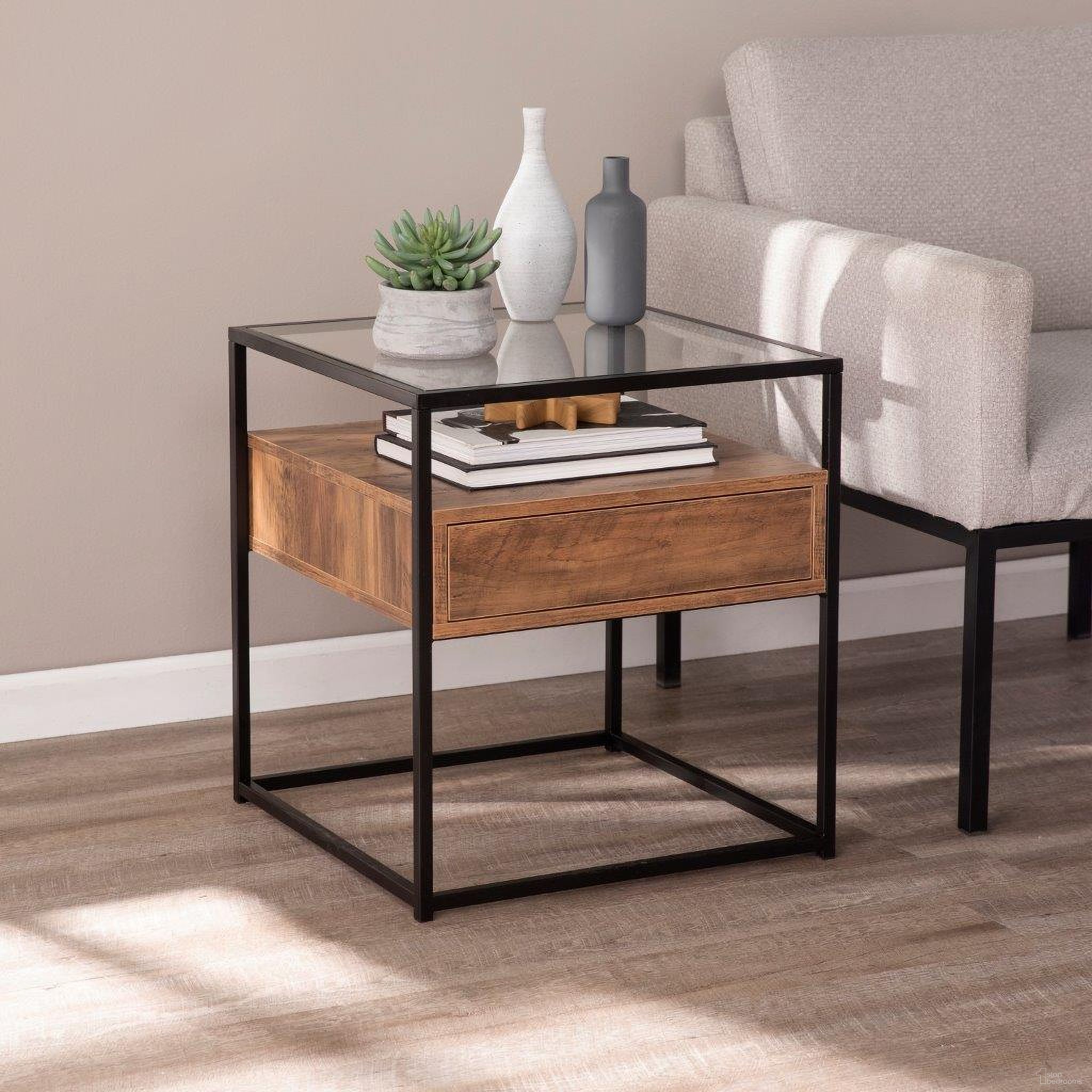 The appearance of Olivern Glass-Top End Table With Storage designed by SEI Furniture in the modern / contemporary interior design. This natural piece of furniture  was selected by 1StopBedrooms from Olivern Collection to add a touch of cosiness and style into your home. Sku: OC1014106. Material: Wood.