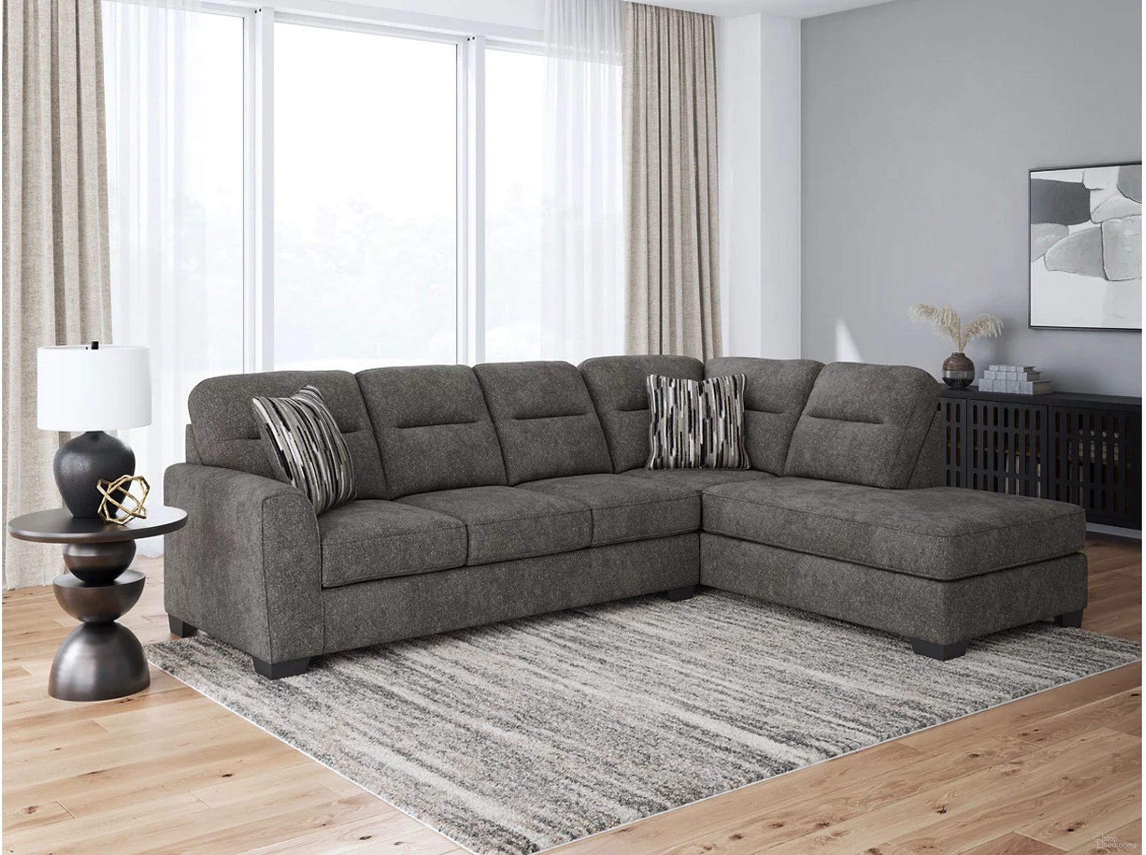 The appearance of Olten 2-Piece RAF Sectional With Chaise In Graphite designed by Signature Design by Ashley in the modern / contemporary interior design. This graphite piece of furniture  was selected by 1StopBedrooms from Olten Collection to add a touch of cosiness and style into your home. Sku: 3130566;3130517. Material: Polyester. Orientation: RAF. Layout: RAF.