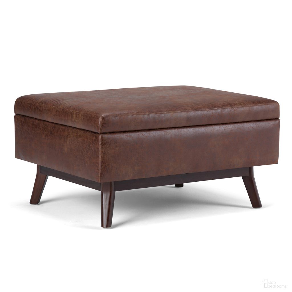 The appearance of Owen Vegan Faux Leather Coffee Table Storage Ottoman In Distressed Saddle Brown designed by Simpli Home in the transitional interior design. This distressed saddle brown piece of furniture was selected by 1StopBedrooms from Owen Collection to add a touch of cosiness and style into your home. Sku: AXCOT267S-DSB. Material: Faux Leather.
