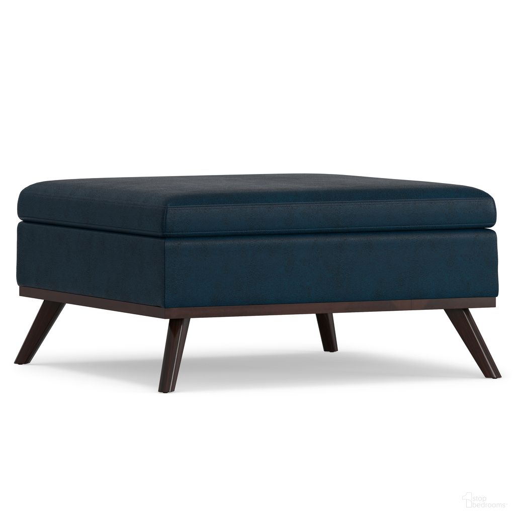 The appearance of Owen Vegan Faux Leather Square Coffee Table Storage Ottoman In Distressed Dark Blue designed by Simpli Home in the transitional interior design. This distressed dark blue piece of furniture was selected by 1StopBedrooms from Owen Collection to add a touch of cosiness and style into your home. Sku: AXCOT267M-DDB. Material: Faux Leather.