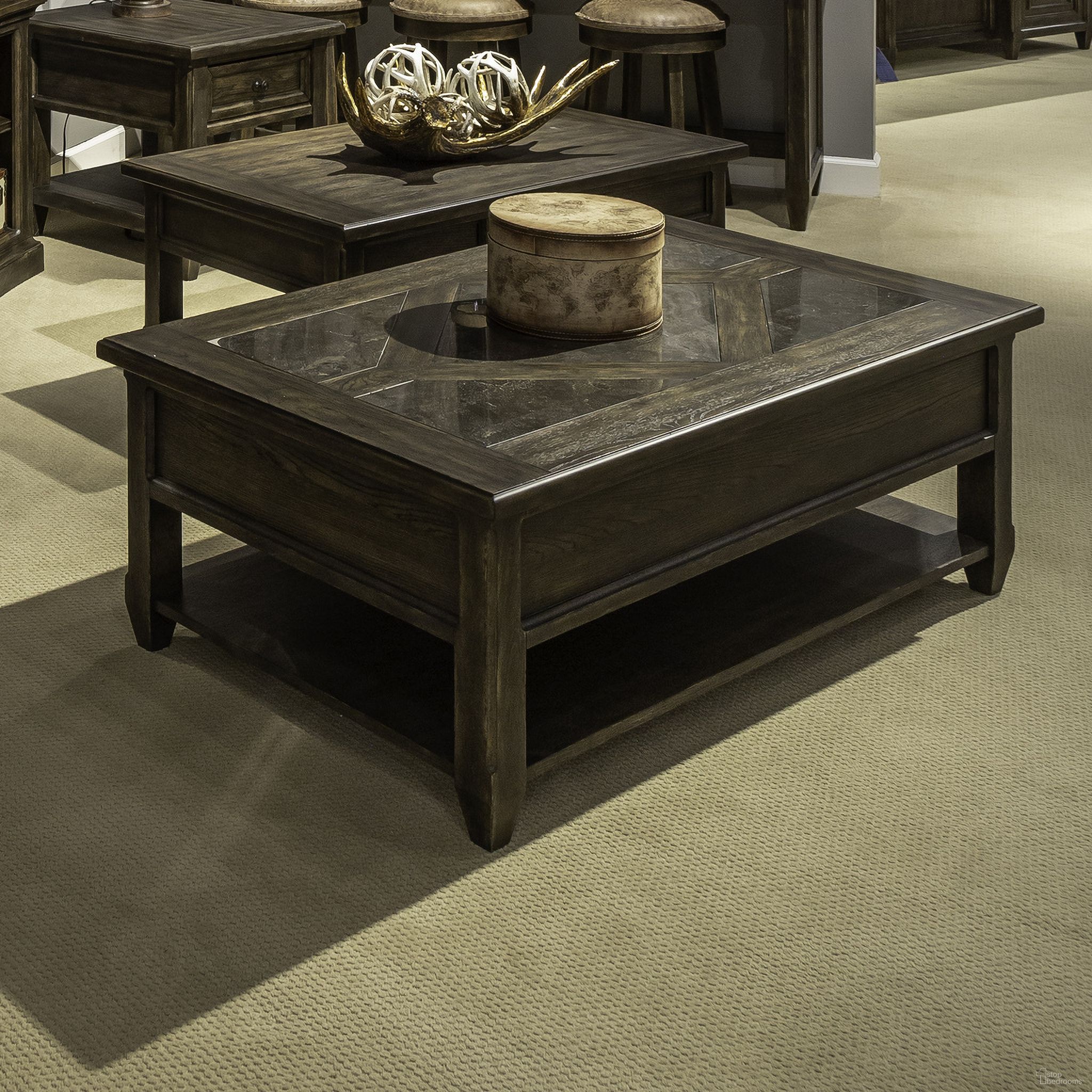 The appearance of Paradise Valley Rectangular Cocktail Table In Saddle Brown designed by Liberty in the traditional interior design. This saddle brown piece of furniture was selected by 1StopBedrooms from Paradise Valley Collection to add a touch of cosiness and style into your home. Sku: 297-OT1010. Material: Rubberwood.