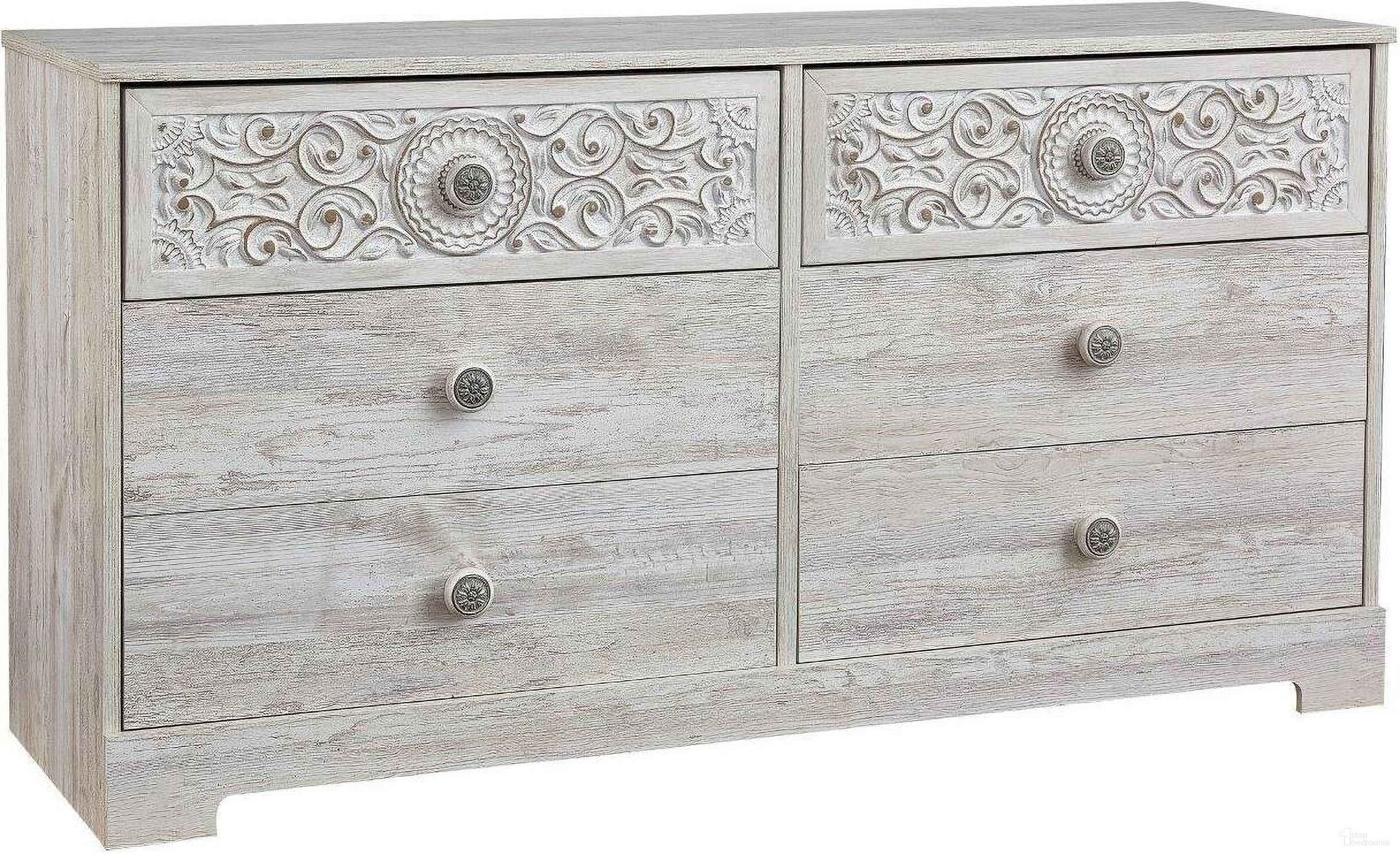 The appearance of Paxberry Whitewash Six Drawer Dresser designed by Signature Design by Ashley in the transitional interior design. This white wash piece of furniture  was selected by 1StopBedrooms from Paxberry Collection to add a touch of cosiness and style into your home. Sku: EB1811-131. Material: Wood.