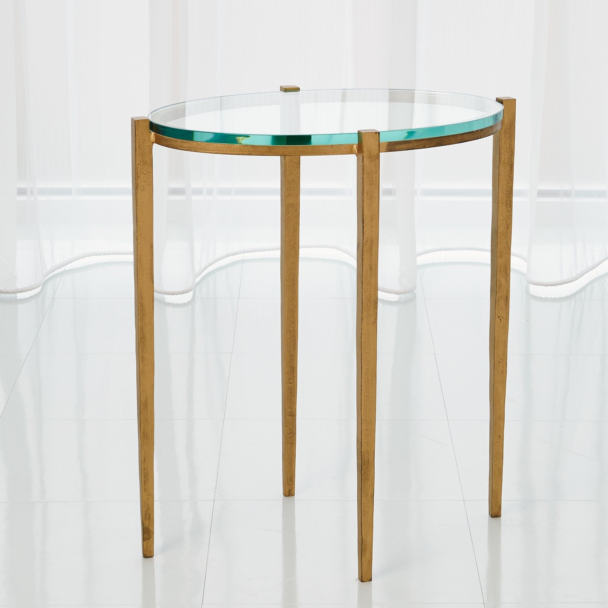 The appearance of Petite Oval Accent Table In Antique Gold designed by Global Views in the modern / contemporary interior design. This gold piece of furniture  was selected by 1StopBedrooms from Petite Collection to add a touch of cosiness and style into your home. Sku: 790764. Material: Iron.