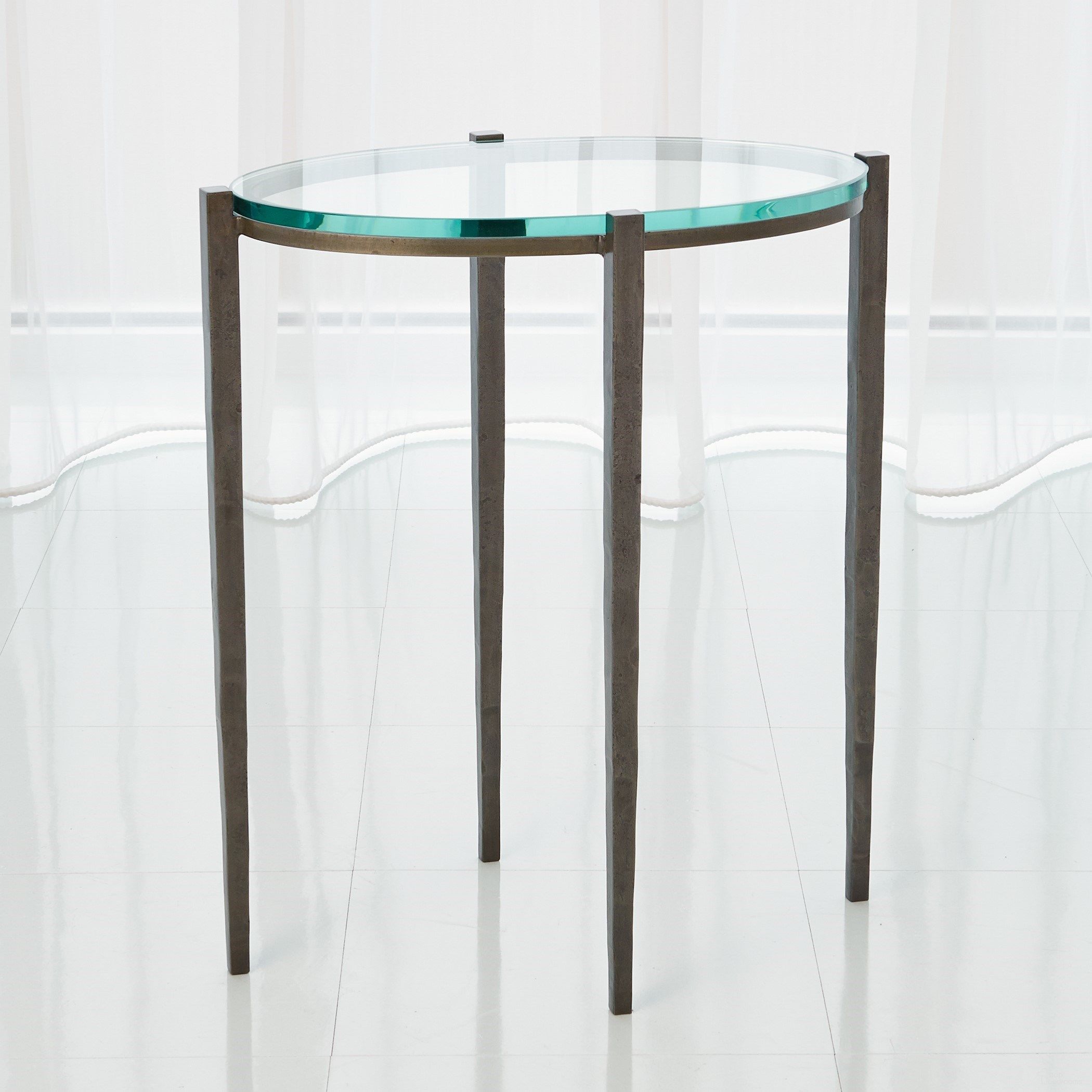 The appearance of Petite Oval Accent Table In Natural Iron designed by Global Views in the modern / contemporary interior design. This gray piece of furniture  was selected by 1StopBedrooms from Petite Collection to add a touch of cosiness and style into your home. Sku: 790765. Material: Iron.