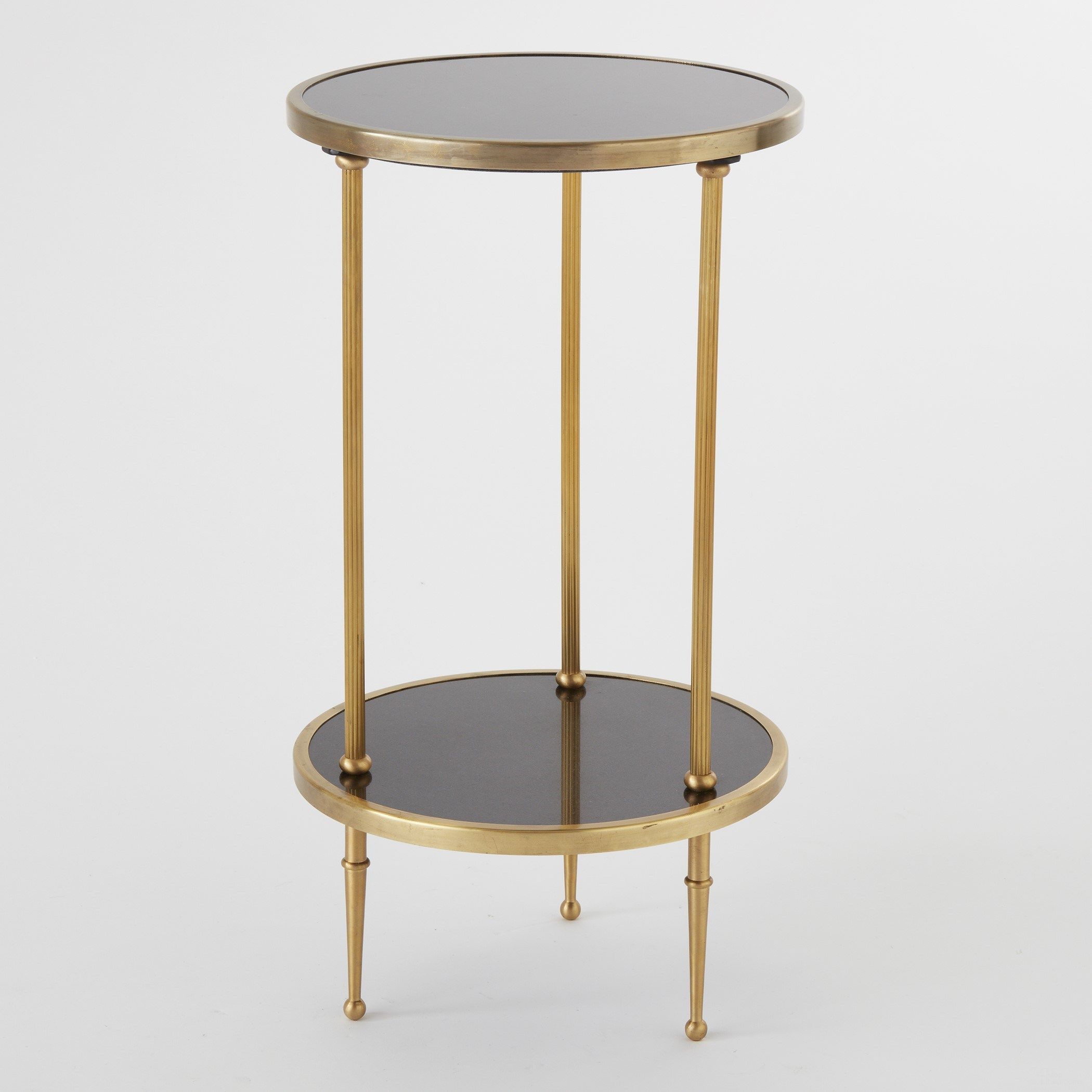 The appearance of Petite Two Tier Table In Antique Brass designed by Global Views in the modern / contemporary interior design. This brass piece of furniture  was selected by 1StopBedrooms from Petite Collection to add a touch of cosiness and style into your home. Sku: 991248. Material: Granite.