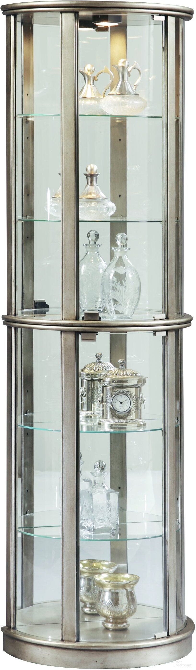 The appearance of Platinum Glass Door Curio With Adjustable Shelves designed by Pulaski in the glam interior design. This silver piece of furniture  was selected by 1StopBedrooms from Curios Collection to add a touch of cosiness and style into your home. Sku: 21395. Material: Glass.
