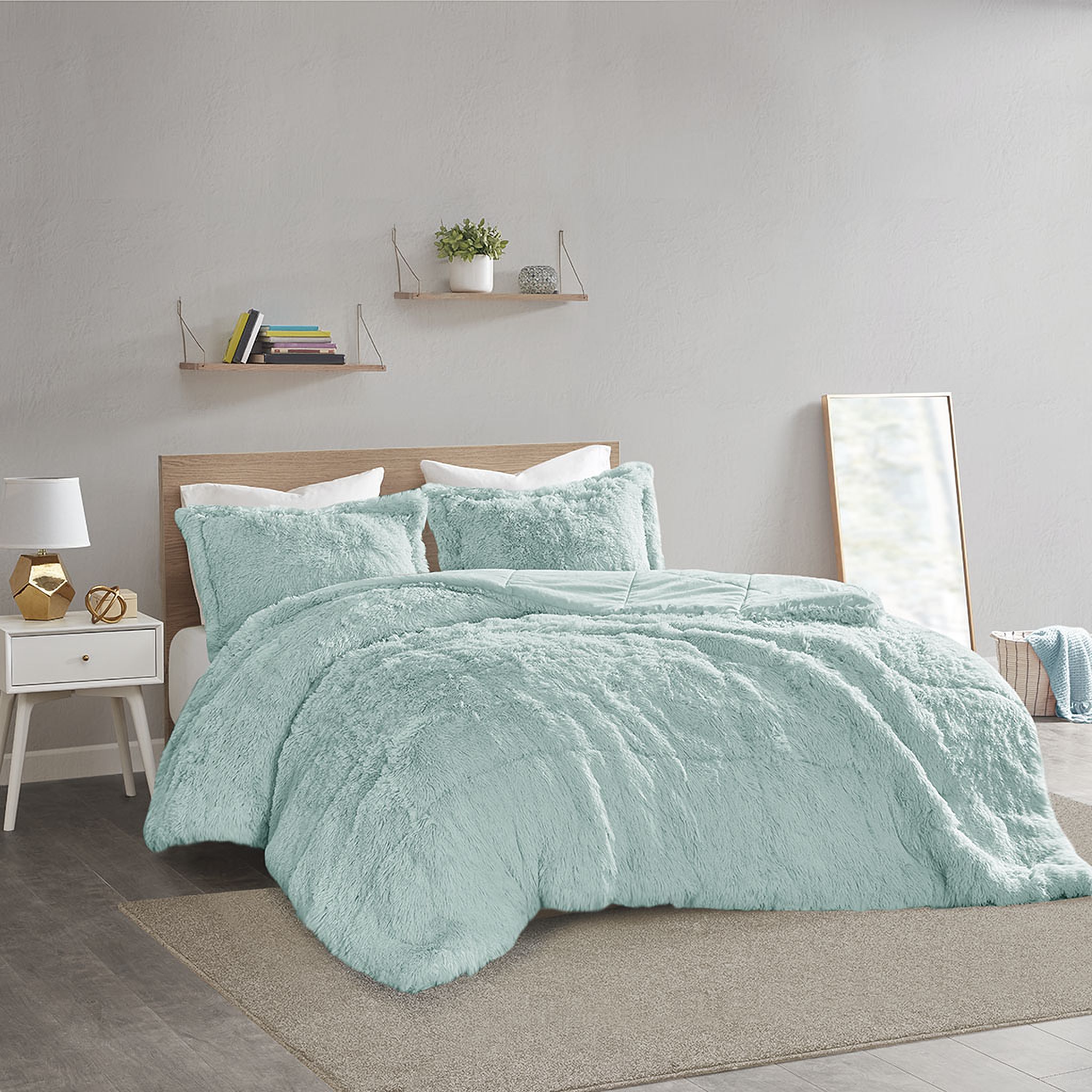 The appearance of Polyester Back Solid Shaggy Long Fur 2 Piece Twin Comforter Set In Aqua designed by Olliix in the transitional interior design. This aqua piece of furniture was selected by 1StopBedrooms from Malea Collection to add a touch of cosiness and style into your home. Sku: ID10-2042. Material: Polyester. Bed Size: Twin.