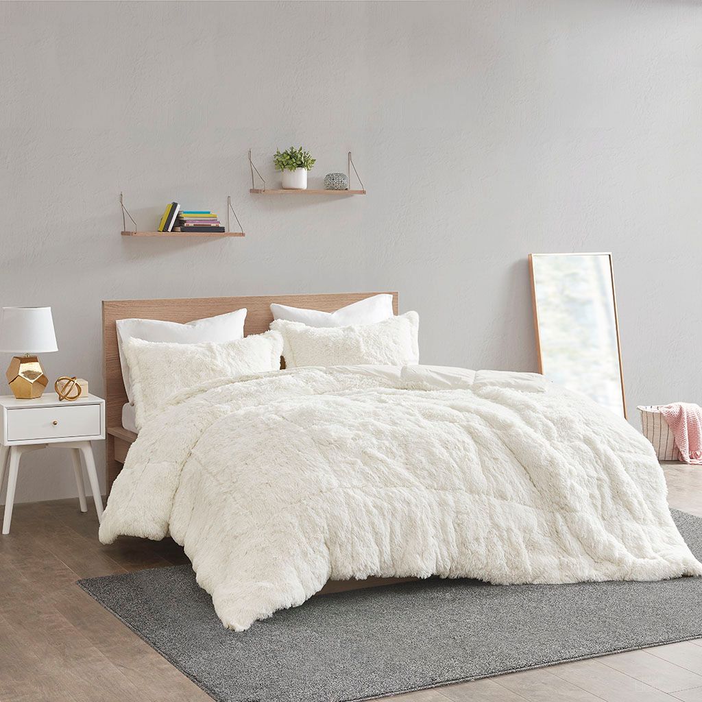 The appearance of Polyester Back Solid Shaggy Long Fur 3 Piece Queen Comforter Set In Ivory designed by Olliix in the transitional interior design. This ivory piece of furniture was selected by 1StopBedrooms from Malea Collection to add a touch of cosiness and style into your home. Sku: ID10-1700. Material: Polyester. Bed Size: Queen.