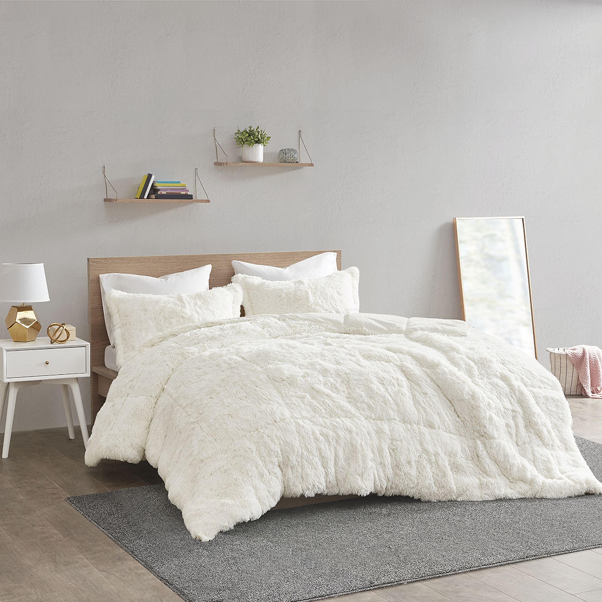 The appearance of Polyester Back Solid Shaggy Long Fur 3 Piece King Comforter Set In Ivory designed by Olliix in the transitional interior design. This ivory piece of furniture was selected by 1StopBedrooms from Malea Collection to add a touch of cosiness and style into your home. Sku: ID10-1701. Material: Polyester. Bed Size: King.