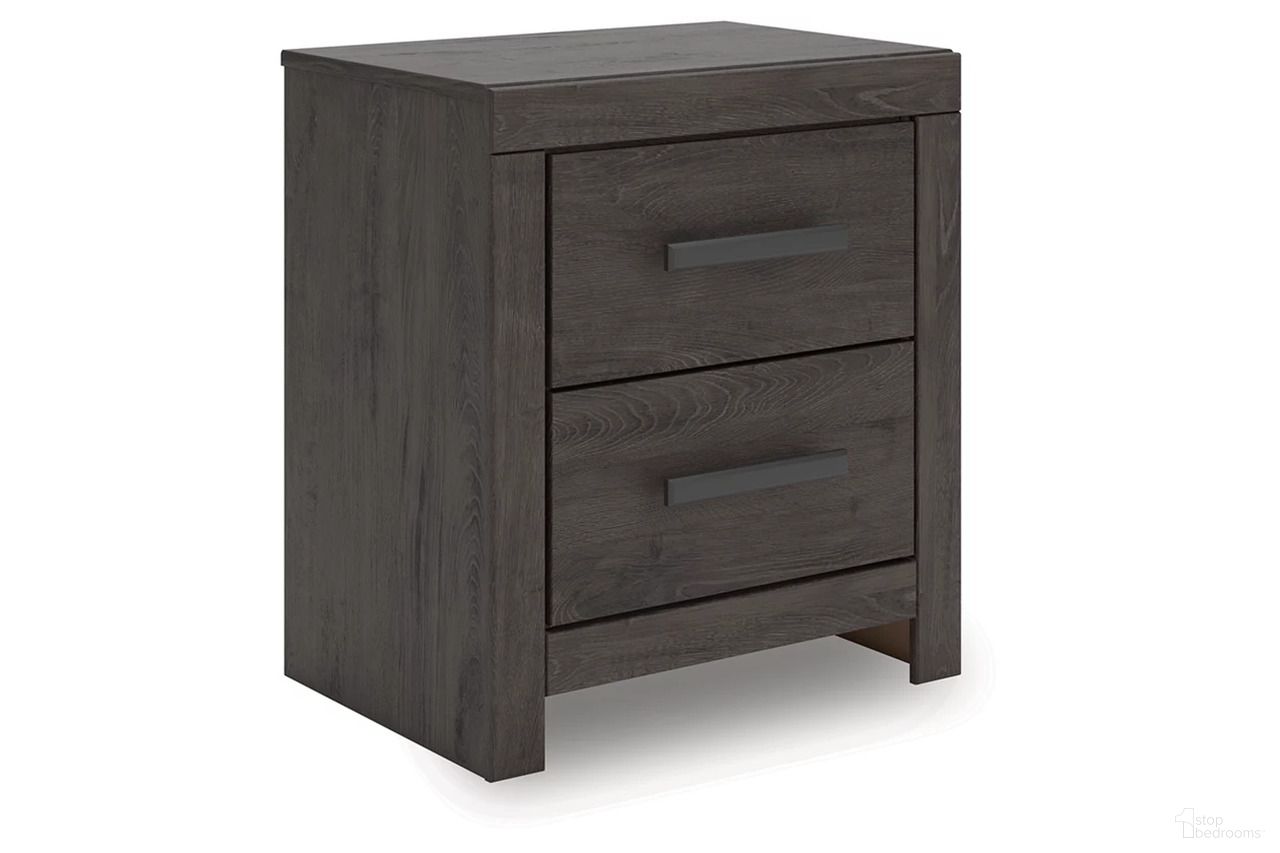 The appearance of Prendonea Nightstand In Charcoal designed by Signature Design by Ashley in the transitional interior design. This charcoal piece of furniture was selected by 1StopBedrooms from Prendonea Collection to add a touch of cosiness and style into your home. Sku: B3789-92. Material: Wood.