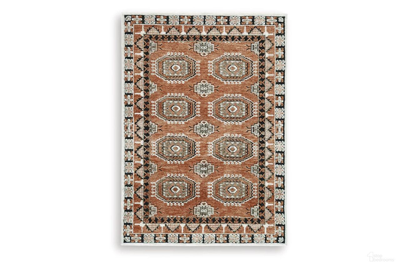 The appearance of Qaabiz 5' x 7' Area Rug In Sienna/Ivory/Black designed by Signature Design by Ashley in the traditional interior design. This sienna/ivory/black piece of furniture was selected by 1StopBedrooms from Qaabiz Collection to add a touch of cosiness and style into your home. Sku: R407522. Material: Polyester.
