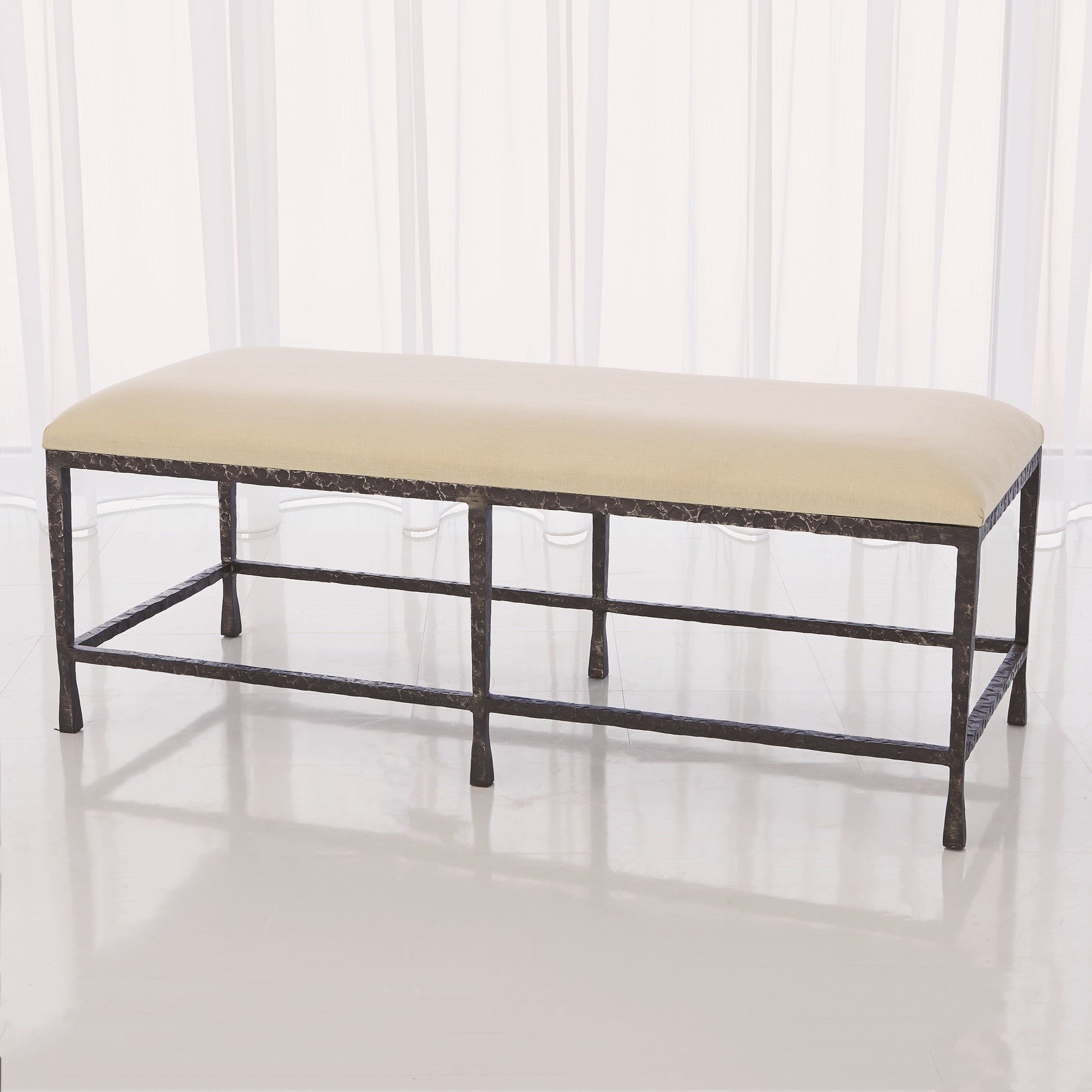 The appearance of Quad Pod Bench With Muslin Cushion In Natural Iron designed by Global Views in the modern / contemporary interior design. This black piece of furniture was selected by 1StopBedrooms from Quad Collection to add a touch of cosiness and style into your home. Sku: 780439. Material: Iron.