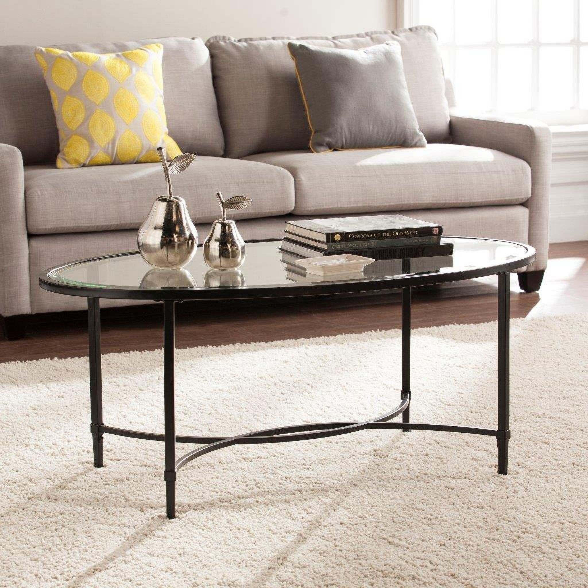 The appearance of Quinton Metal And Glass Oval Cocktail Table In Black designed by SEI Furniture in the modern / contemporary interior design. This black piece of furniture was selected by 1StopBedrooms from Quinton Collection to add a touch of cosiness and style into your home. Sku: CK3600. Material: Glass.