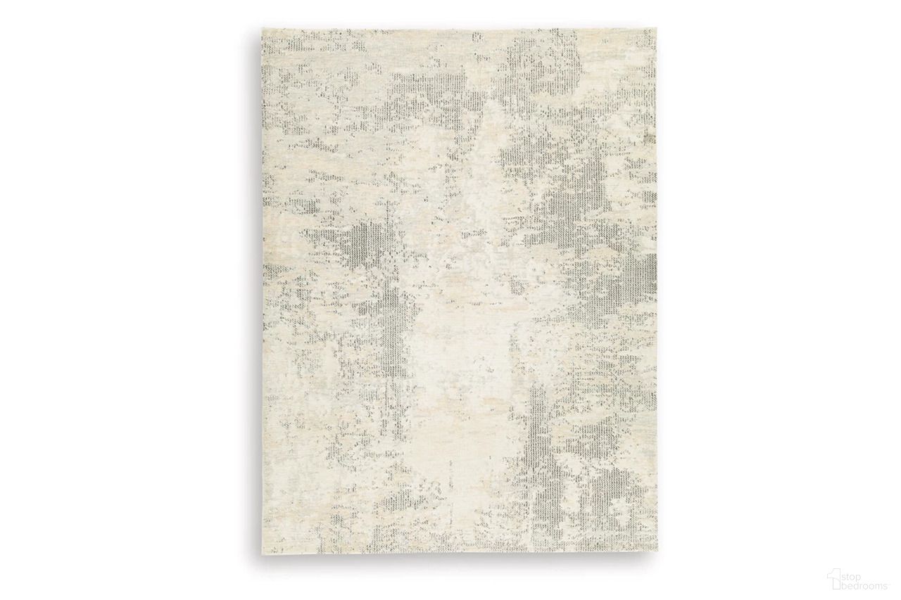 The appearance of Raif Large Rug In Gray and White designed by Signature Design by Ashley in the modern / contemporary interior design. This gray/white/cream piece of furniture  was selected by 1StopBedrooms from Raif Collection to add a touch of cosiness and style into your home. Sku: R408081.
