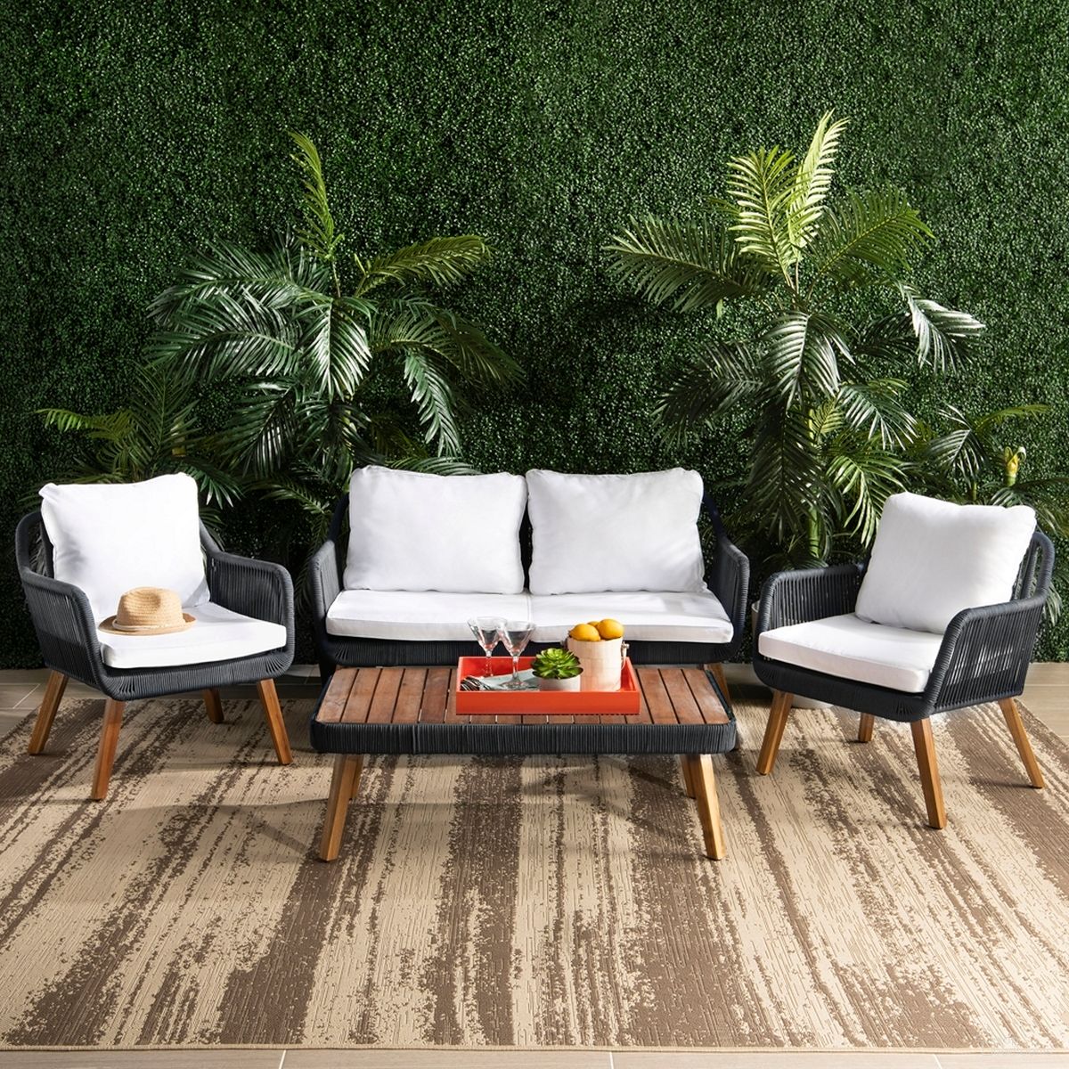 The appearance of Raldin Rope 4 Pc Living Set in Black and White designed by Safavieh in the modern / contemporary interior design. This black and white piece of furniture  was selected by 1StopBedrooms from Raldin Collection to add a touch of cosiness and style into your home. Sku: PAT7049B. Material: Wood.