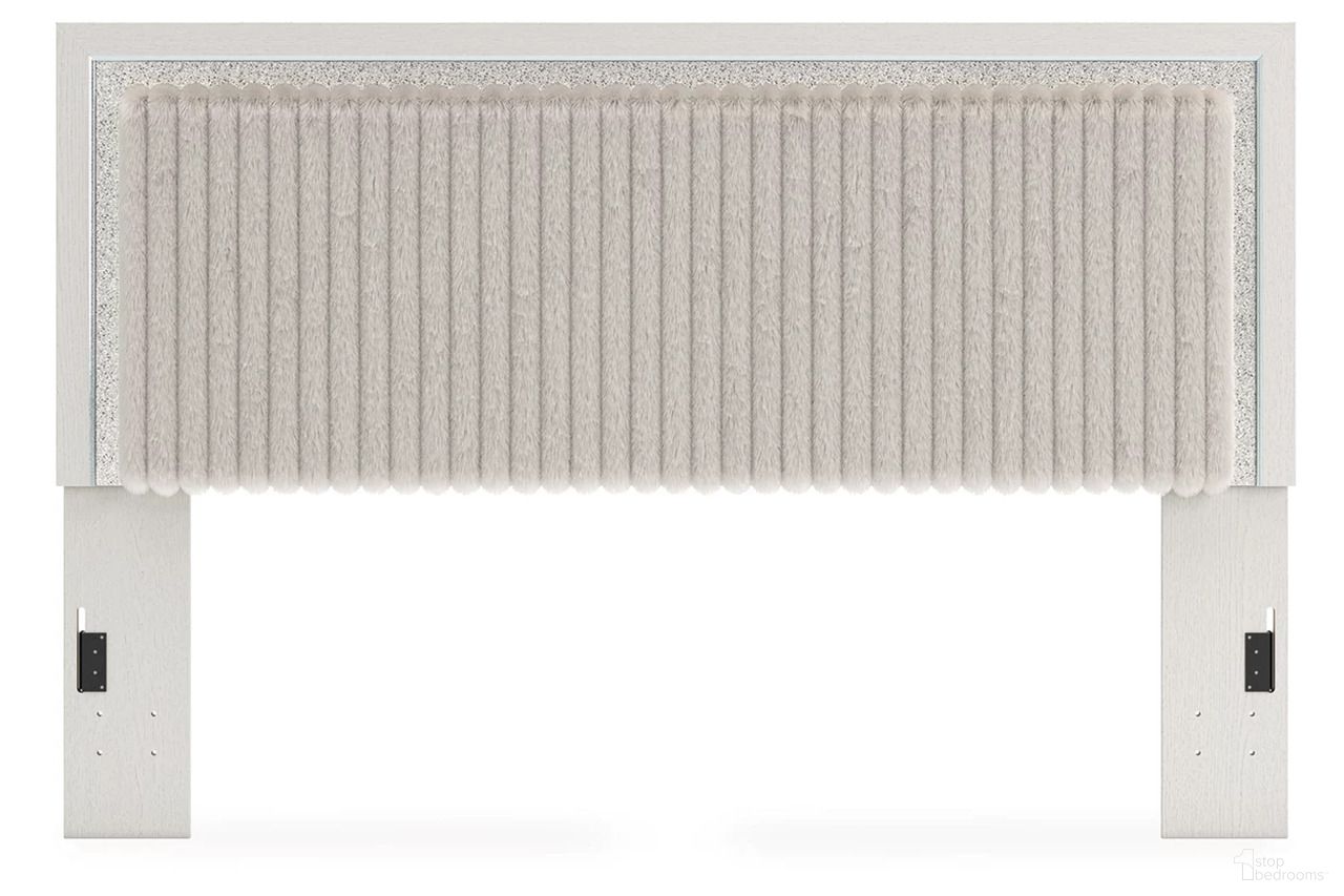 The appearance of Ravalori King Upholstered Panel Headboard In White designed by Signature Design by Ashley in the modern / contemporary interior design. This white piece of furniture  was selected by 1StopBedrooms from Ravalori Collection to add a touch of cosiness and style into your home. Sku: NCB3381-58. Material: Fabric. Bed Size: King.