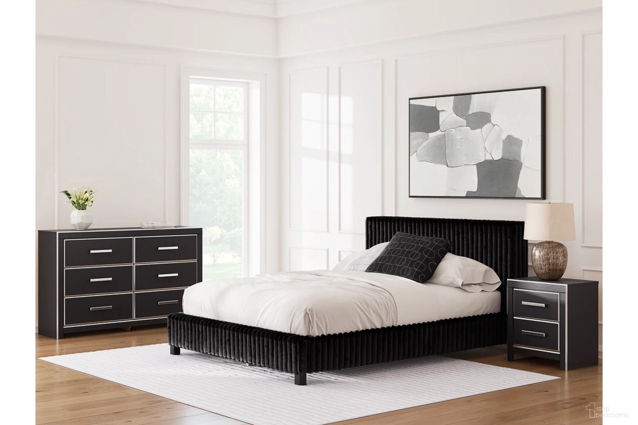 The appearance of Ravalori Upholstered Panel Bedroom Set In Black designed by Signature Design by Ashley in the modern / contemporary interior design. This black piece of furniture was selected by 1StopBedrooms from Ravalori Collection to add a touch of cosiness and style into your home. Sku: NCB3380-54;NCB3380-57;NCB3380-96;NCB3380-92. Material: Fabric. Bed Size: Queen.
