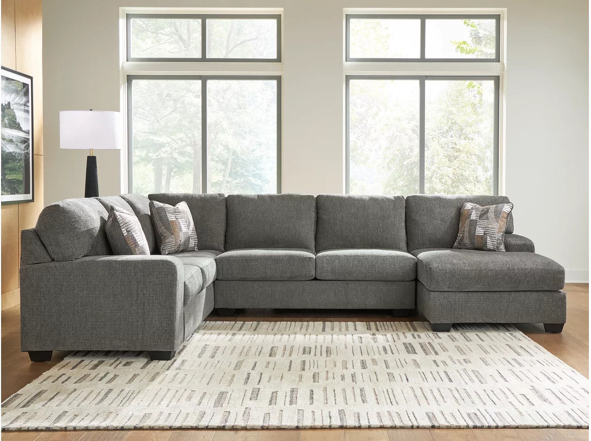 The appearance of Revenna 3-Piece RAF Sectional with Chaise In Greystone designed by Signature Design by Ashley in the modern / contemporary interior design. This greystone piece of furniture was selected by 1StopBedrooms from Revenna Collection to add a touch of cosiness and style into your home. Sku: NC4840517;NC4840534;NC4840548. Material: Polyester. Orientation: RAF.