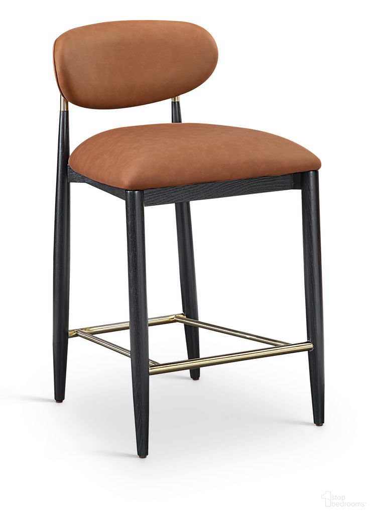 The appearance of Riccio Vegan Leather Upholstered Stool In Cognac and Stained Black designed by Meridian in the modern / contemporary interior design. This cognac/stained black piece of furniture  was selected by 1StopBedrooms from Riccio Collection to add a touch of cosiness and style into your home. Sku: 11037Cognac-C. Material: Vegan Leather.
