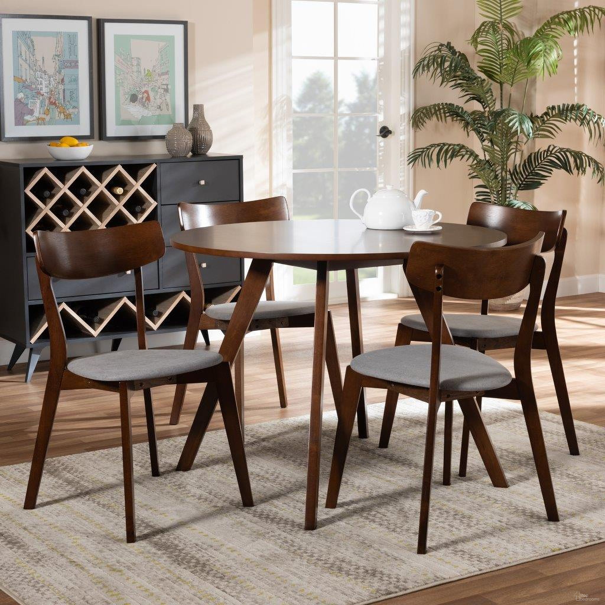 The appearance of Rika Mid-Century Modern Transitional Light Grey Fabric Upholstered and Walnut Brown Finished Wood 5-Piece Dining Set designed by Baxton Studio in the transitional interior design. This walnut piece of furniture was selected by 1StopBedrooms from Rika Collection to add a touch of cosiness and style into your home. Sku: Iora/Hexa-Smoke/Walnut-5PC Dining Set. Material: Polyester.