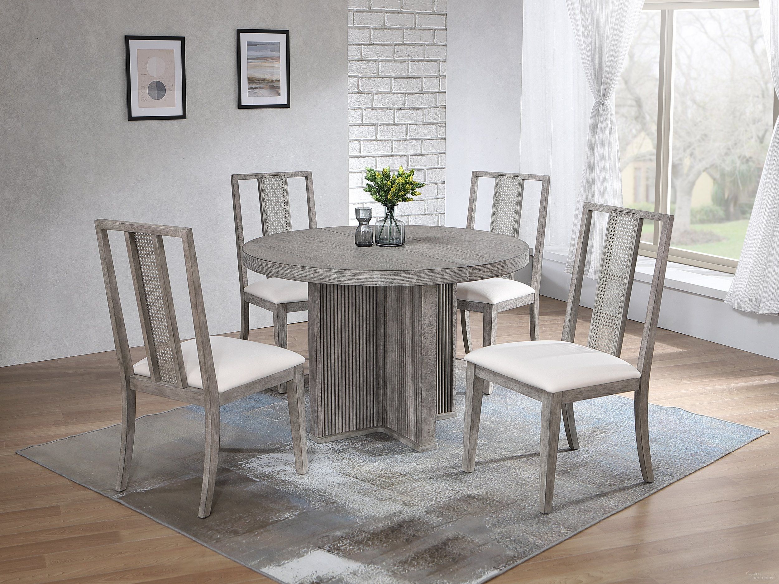 The appearance of Ripple Dining Table and Max 5-Piece Dining Set In Dove Grey designed by Iconic Furniture in the modern / contemporary interior design. This dove grey piece of furniture  was selected by 1StopBedrooms from Urbana Collection to add a touch of cosiness and style into your home. Sku: RD45RPLCH66U01DG-5PC. Table Base Style: Pedestal. Table Top Shape: Round. Material: Rubberwood.