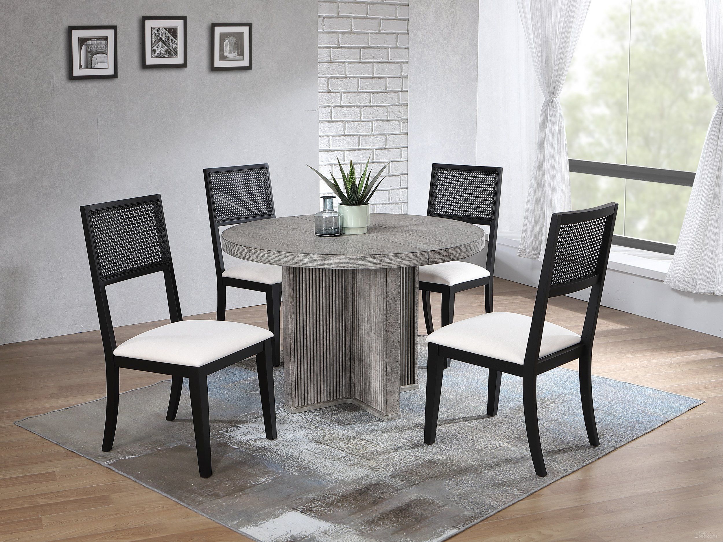 The appearance of Ripple Dining Table and Robin 5-Piece Dining Set In Dove Grey and Black Finish designed by Iconic Furniture in the modern / contemporary interior design. This dove grey/black piece of furniture was selected by 1StopBedrooms from Urbana Collection to add a touch of cosiness and style into your home. Sku: RD45RPLDG-CH67U01BLKDG-5PC. Table Base Style: Pedestal. Table Top Shape: Round. Material: Rubberwood.
