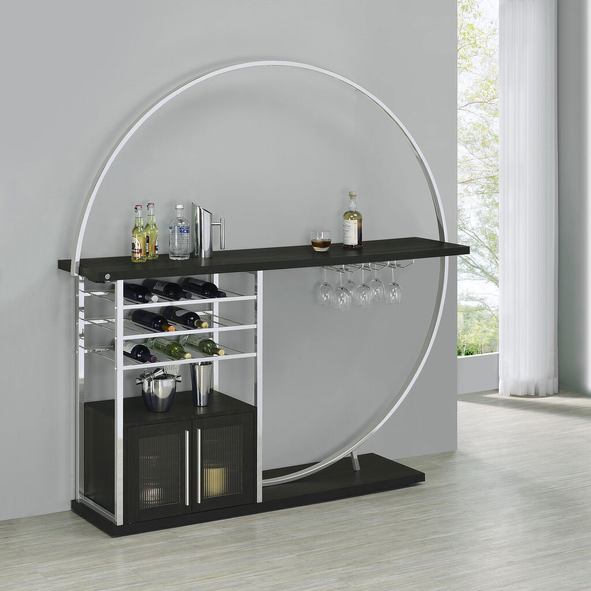 The appearance of Risley 2-door Circular LED Home Bar with Wine Storage Dark Charcoal designed by Coaster in the modern / contemporary interior design. This dark charcoal piece of furniture was selected by 1StopBedrooms from Risley Collection to add a touch of cosiness and style into your home. Sku: 182799. Material: Wood.