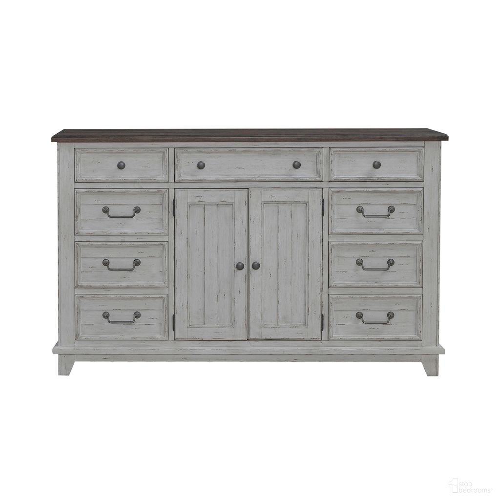 The appearance of River Place 2 Door 9 Drawer Dresser In Riverstone White and Tobacco designed by Liberty in the country / farmhouse interior design. This white piece of furniture was selected by 1StopBedrooms from River Place Collection to add a touch of cosiness and style into your home. Sku: 237-BR31. Material: Wood Veneer.