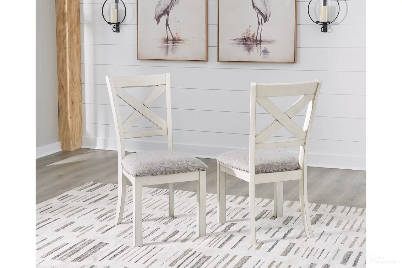 The appearance of Robbinsdale Dining Chair Set of 2 In Antique White designed by Signature Design by Ashley in the transitional interior design. This antique white piece of furniture  was selected by 1StopBedrooms from Robbinsdale Collection to add a touch of cosiness and style into your home. Sku: D642-01. Material: Fabric. Chair Type: Side Chair.