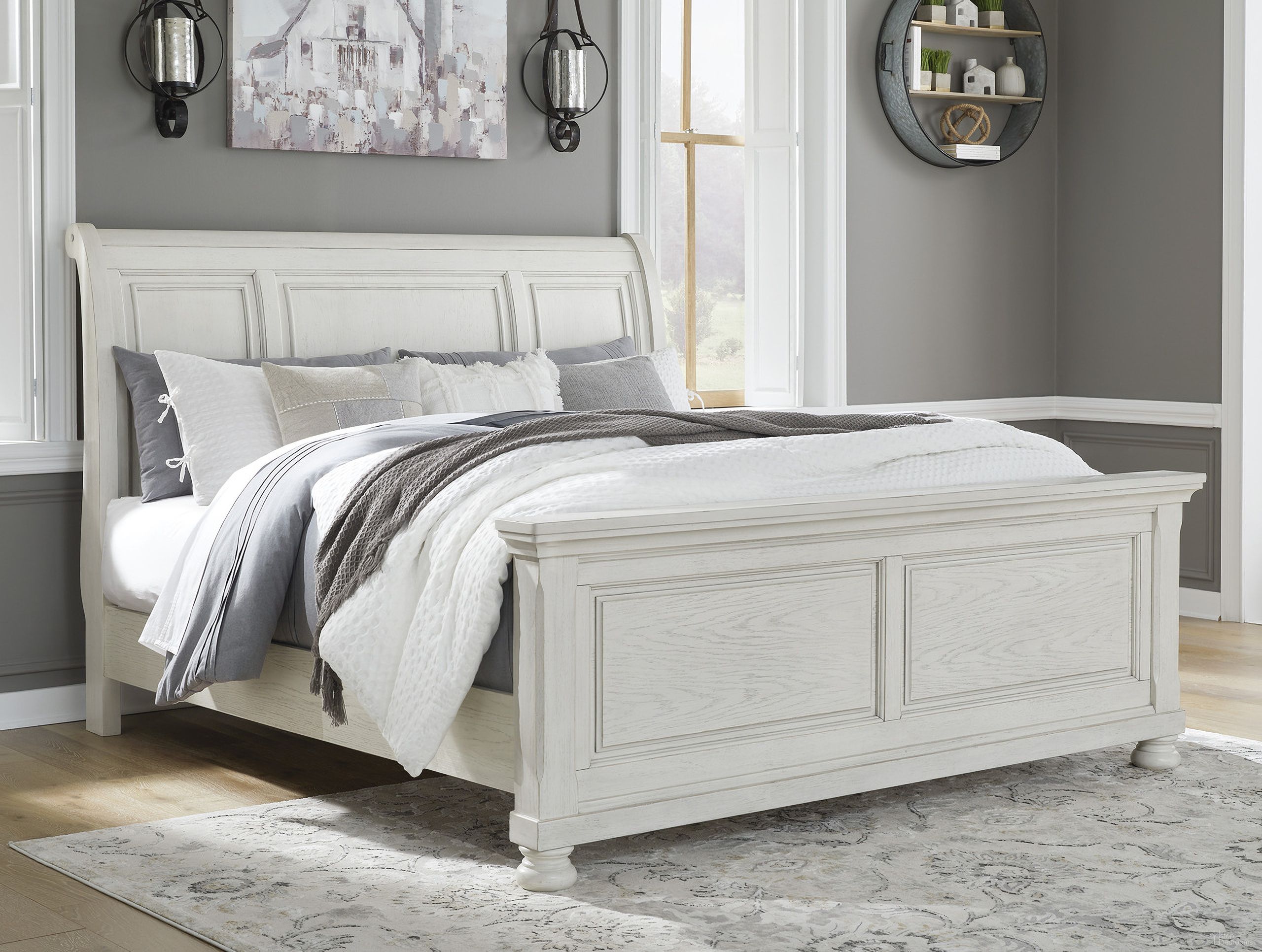 The appearance of Robbinsdale Queen Sleigh Bed In Antique White designed by Signature Design by Ashley in the transitional interior design. This antique white piece of furniture was selected by 1StopBedrooms from Robbinsdale Collection to add a touch of cosiness and style into your home. Sku: B742-54;B742-77;B742-96. Bed Type: Sleigh Bed. Material: Wood. Bed Size: Queen.