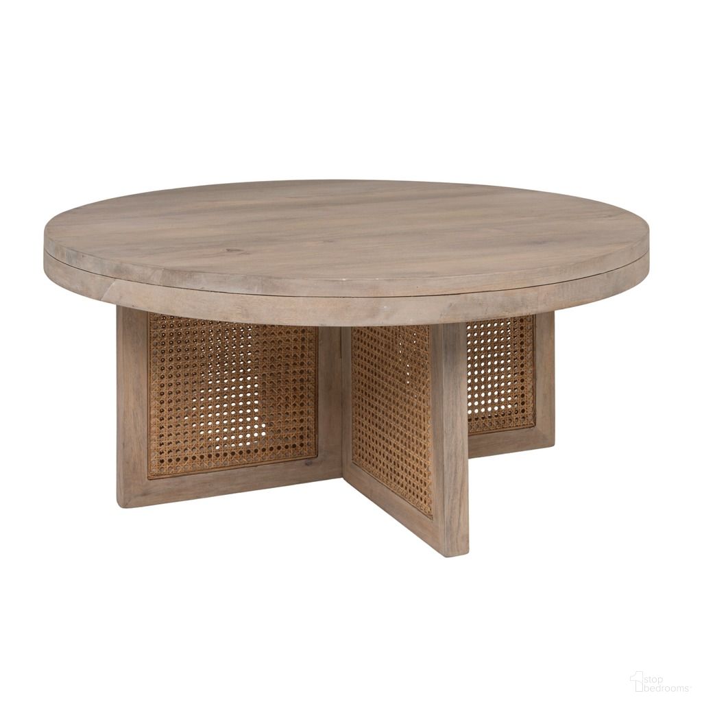 The appearance of Rowan Mango Wood and Cane Round Coffee Table In Natural designed by Rowena Interiors in the coastal interior design. This natural piece of furniture  was selected by 1StopBedrooms from Rowan Collection to add a touch of cosiness and style into your home. Sku: EC2179. Material: Mango Wood.