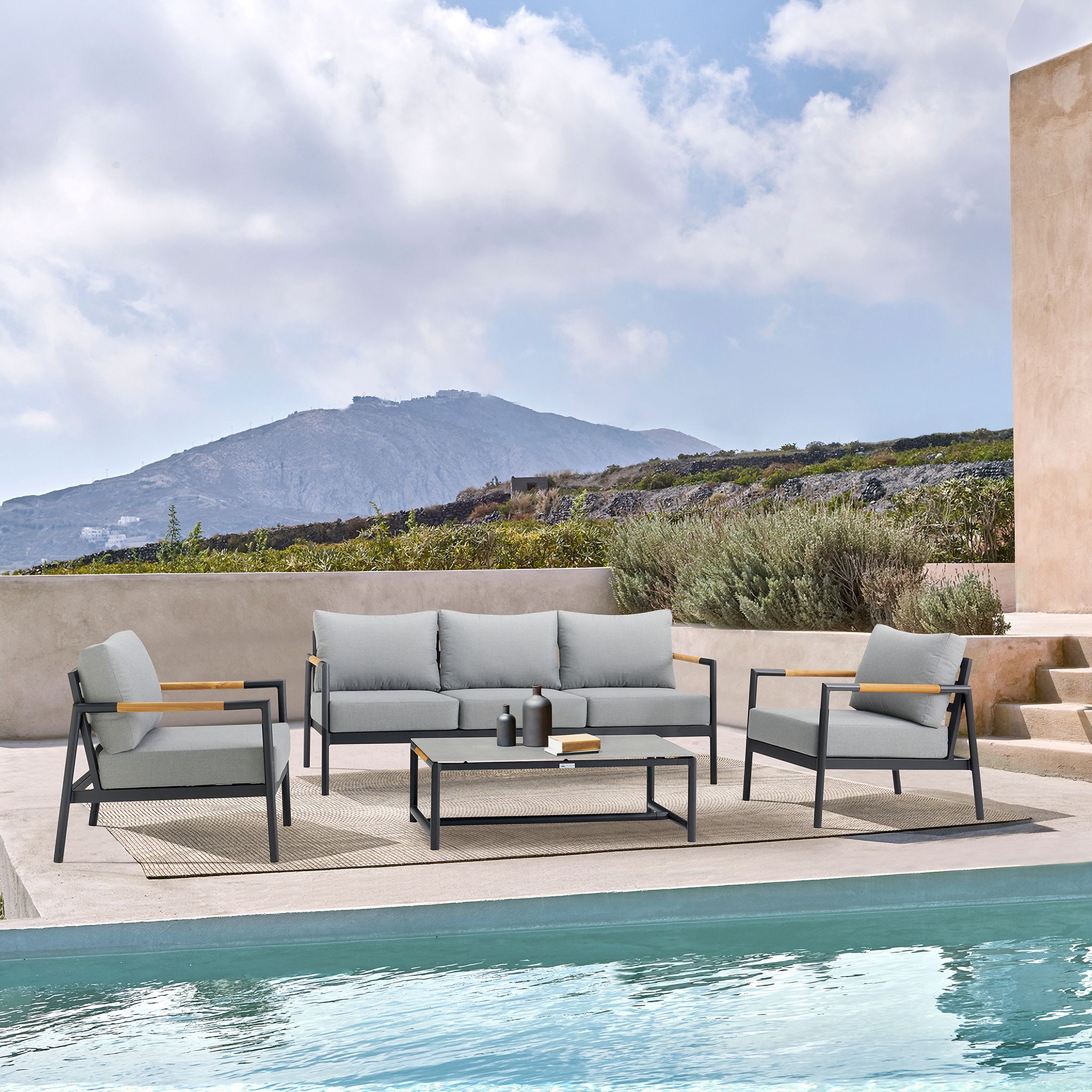 The appearance of Royal 4-Piece Black Aluminum and Teak Outdoor Seating Set with Dark Gray Cushions designed by Armen Living in the modern / contemporary interior design. This dark gray piece of furniture was selected by 1StopBedrooms from Royal Collection to add a touch of cosiness and style into your home. Sku: 795154121892BX1;795154121892BX2;795154121892BX3;795154121892BX4. Material: Aluminum.