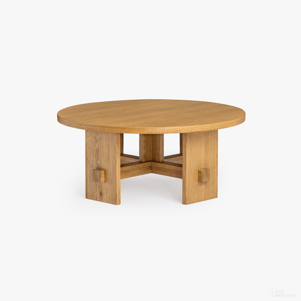 The appearance of Saguaro Round Oak Small Coffee Table In Honey Oak designed by Co. House Designs in the coastal interior design. This honey oak piece of furniture  was selected by 1StopBedrooms from Saguaro Collection to add a touch of cosiness and style into your home. Sku: CH-1001848-VN14-FN-LV-CT-NT-MD. Material: Solid Oak.